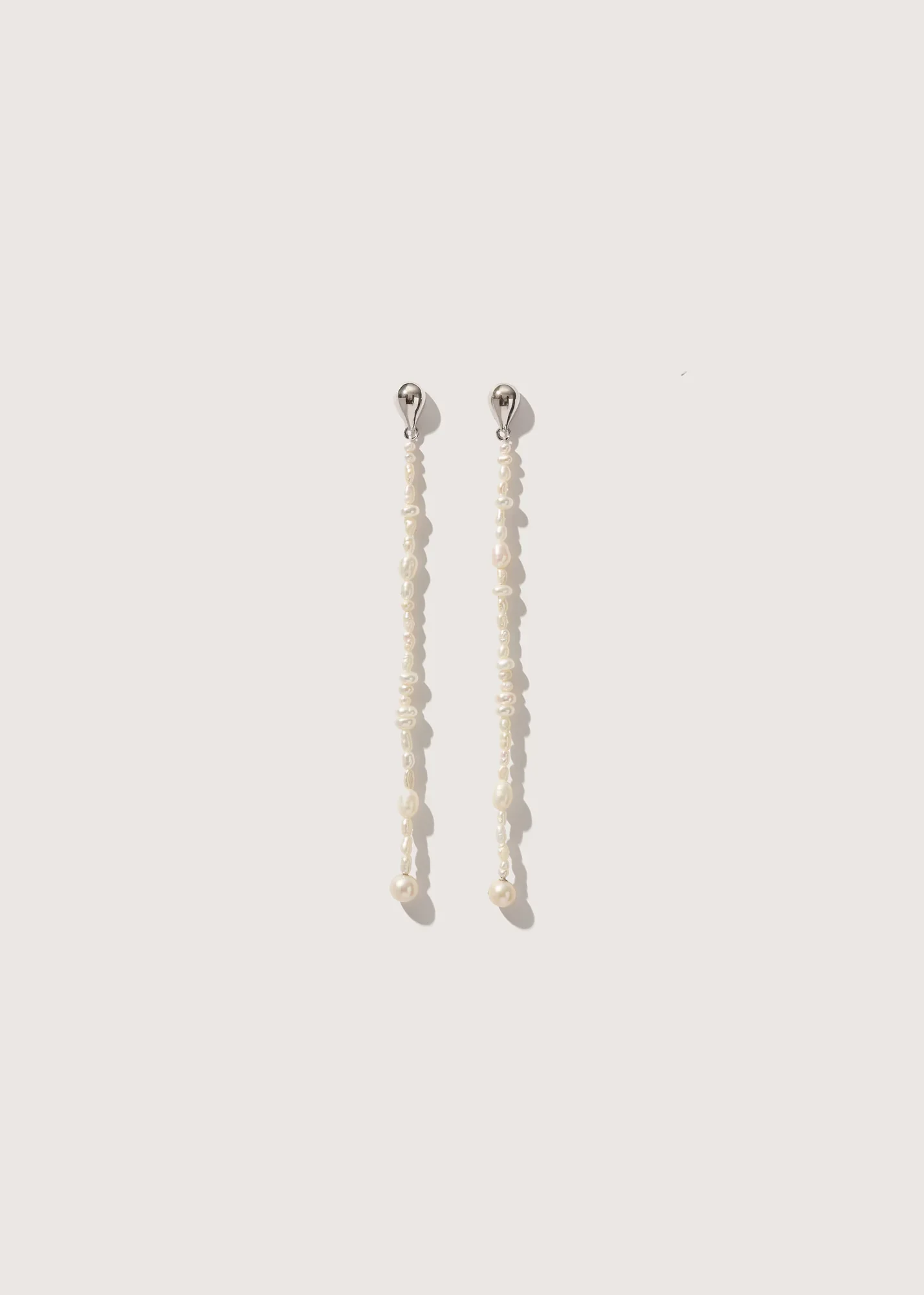 reverie_pearl_drop_earrings_af9eb592-7d65-4c5d-946e-8b1a7f6f998e_1428x2000_crop_center.progressive.webp