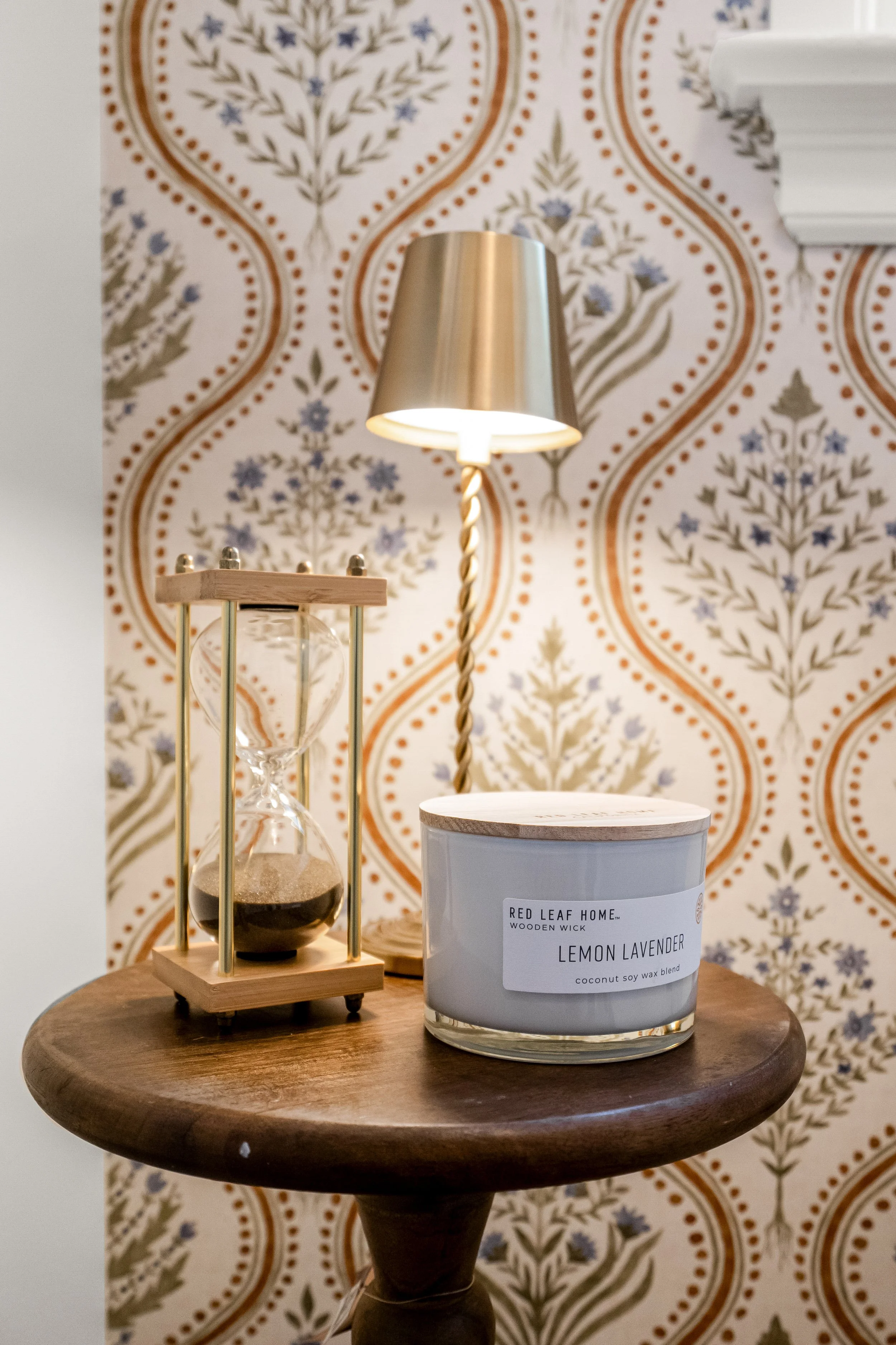Powder room vanity and finishes in a Williamsburg, VA remodel created by converting the home’s former laundry room into a guest powder bath. Designed by AWH Interiors.