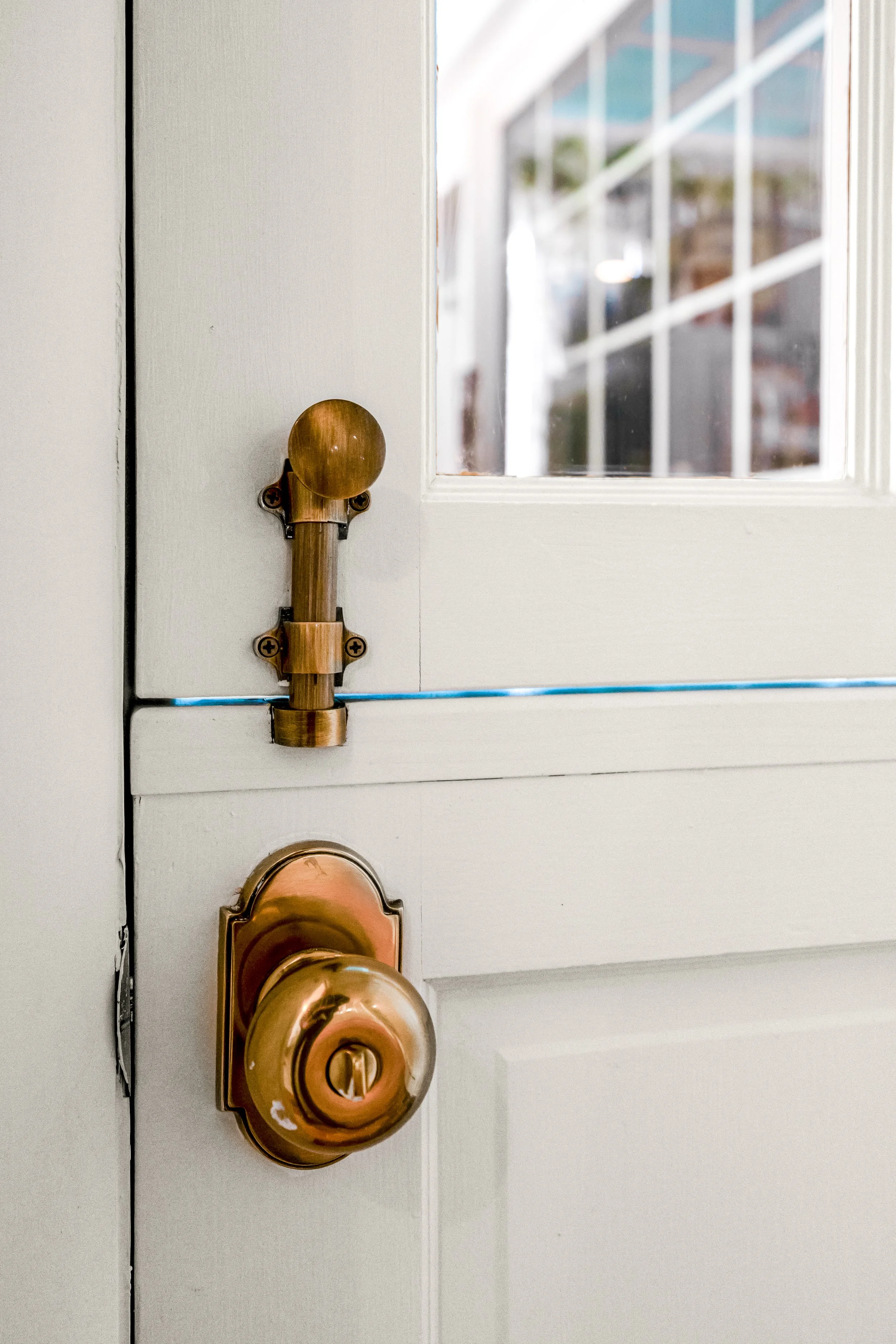 Dutch door detail connecting kitchen and pantry in a Williamsburg, Virginia remodel by AWH Interiors.