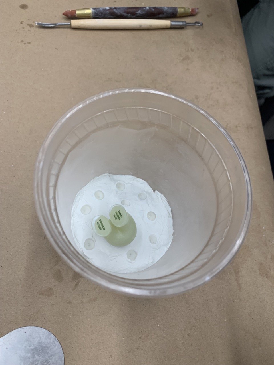 Using clay to set the bottom of the mold