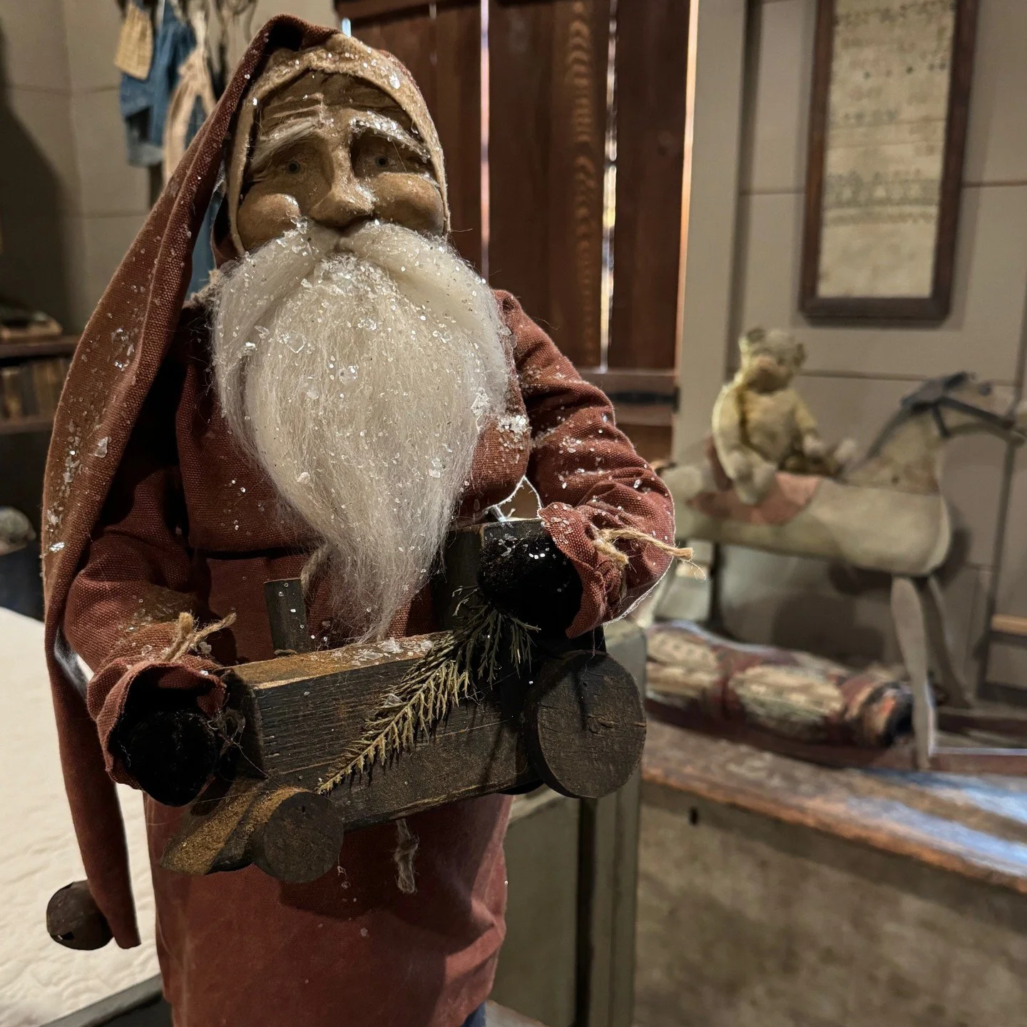 2026 Santa wearing red coat nad holding a train