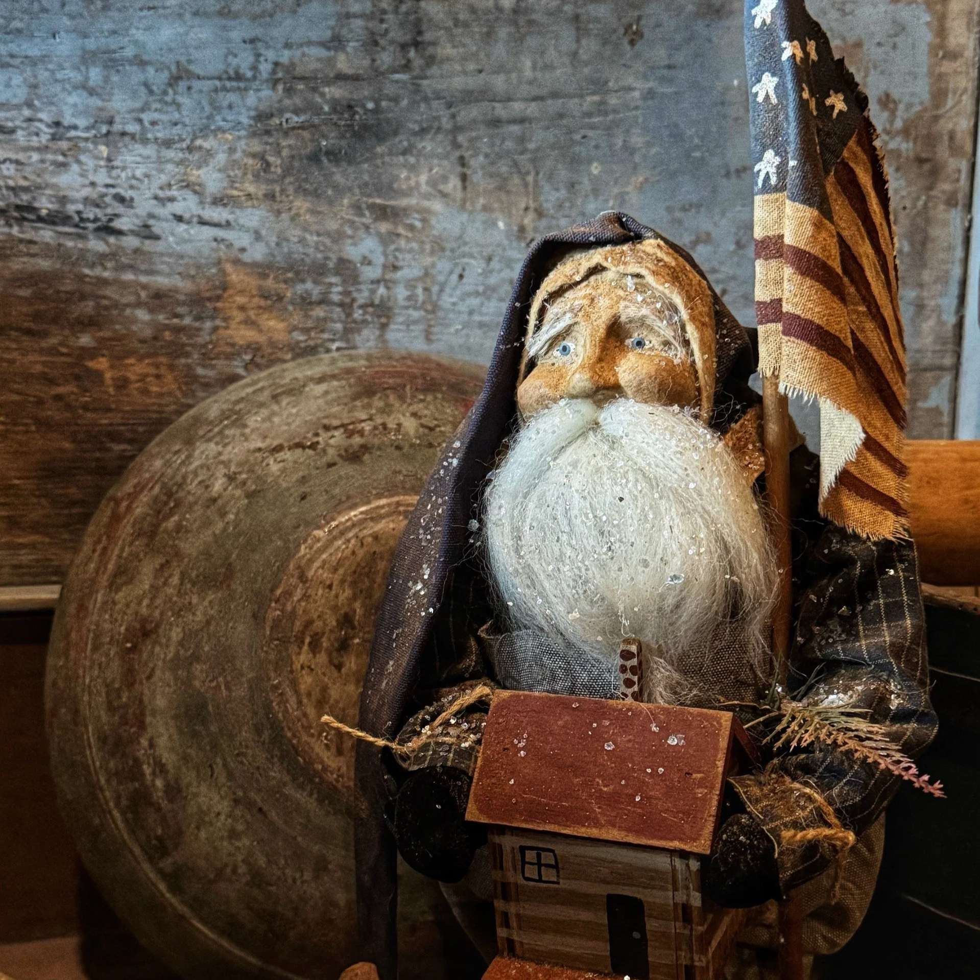 2026 Santa holding a cabin and flag