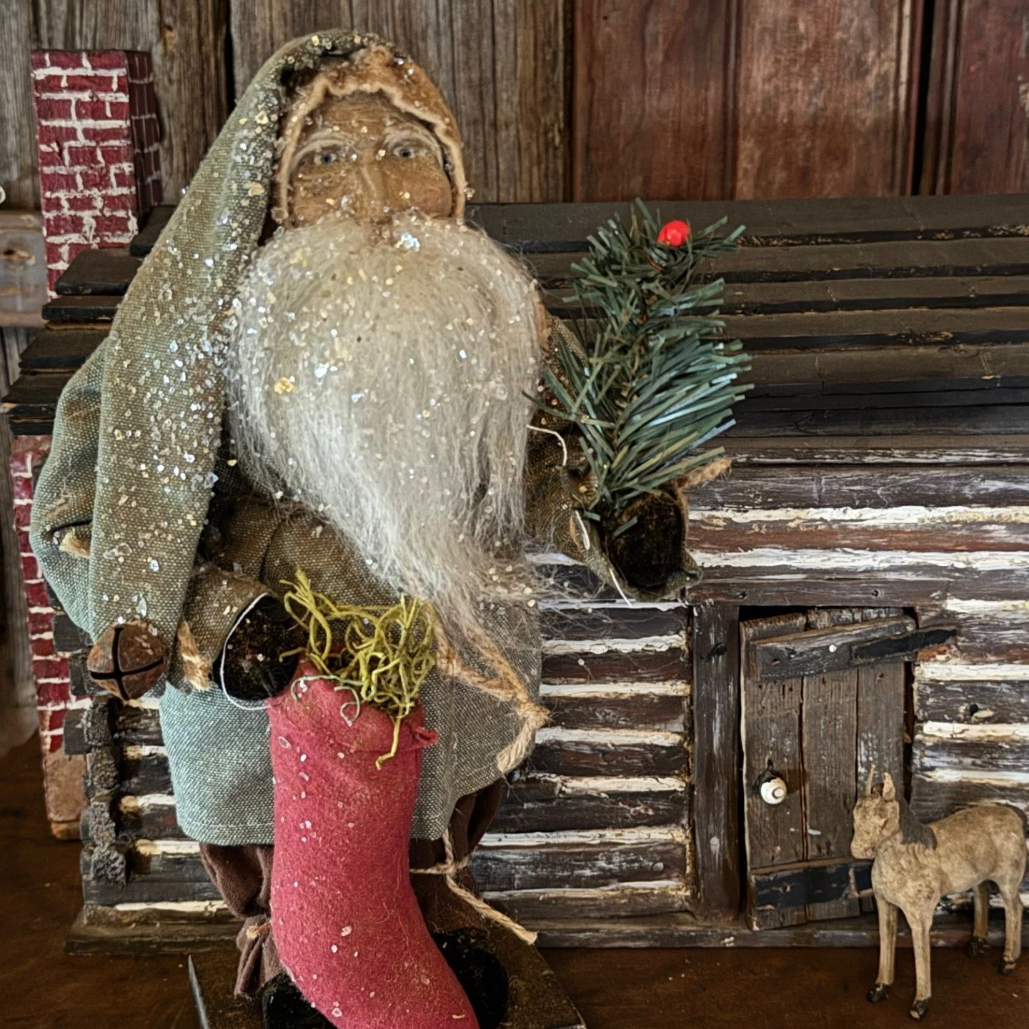 2026 Tiny Santa in green coat with stocking