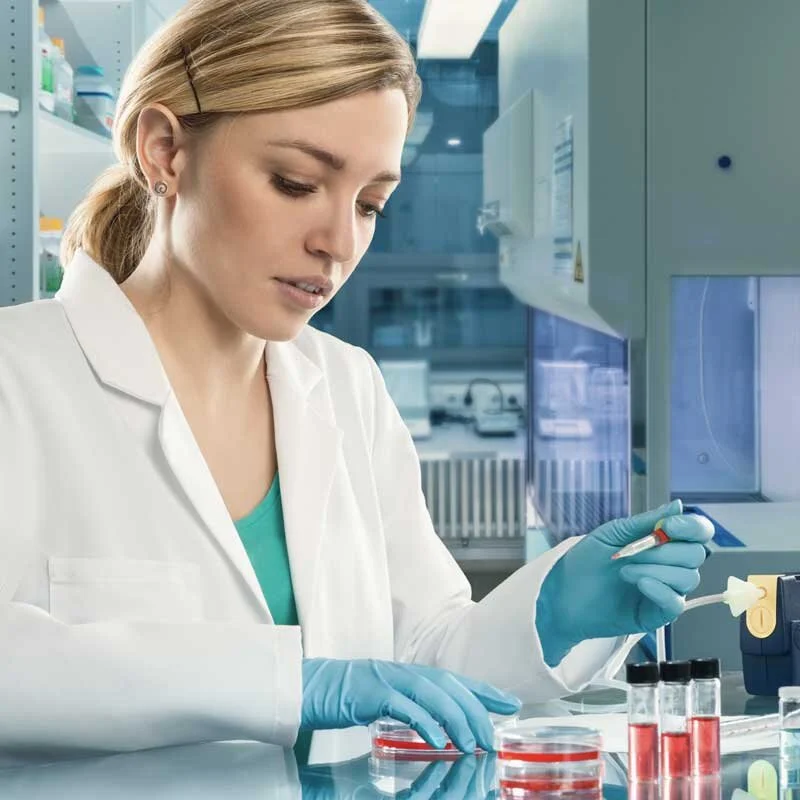 A Tech working with Cultured Cells.