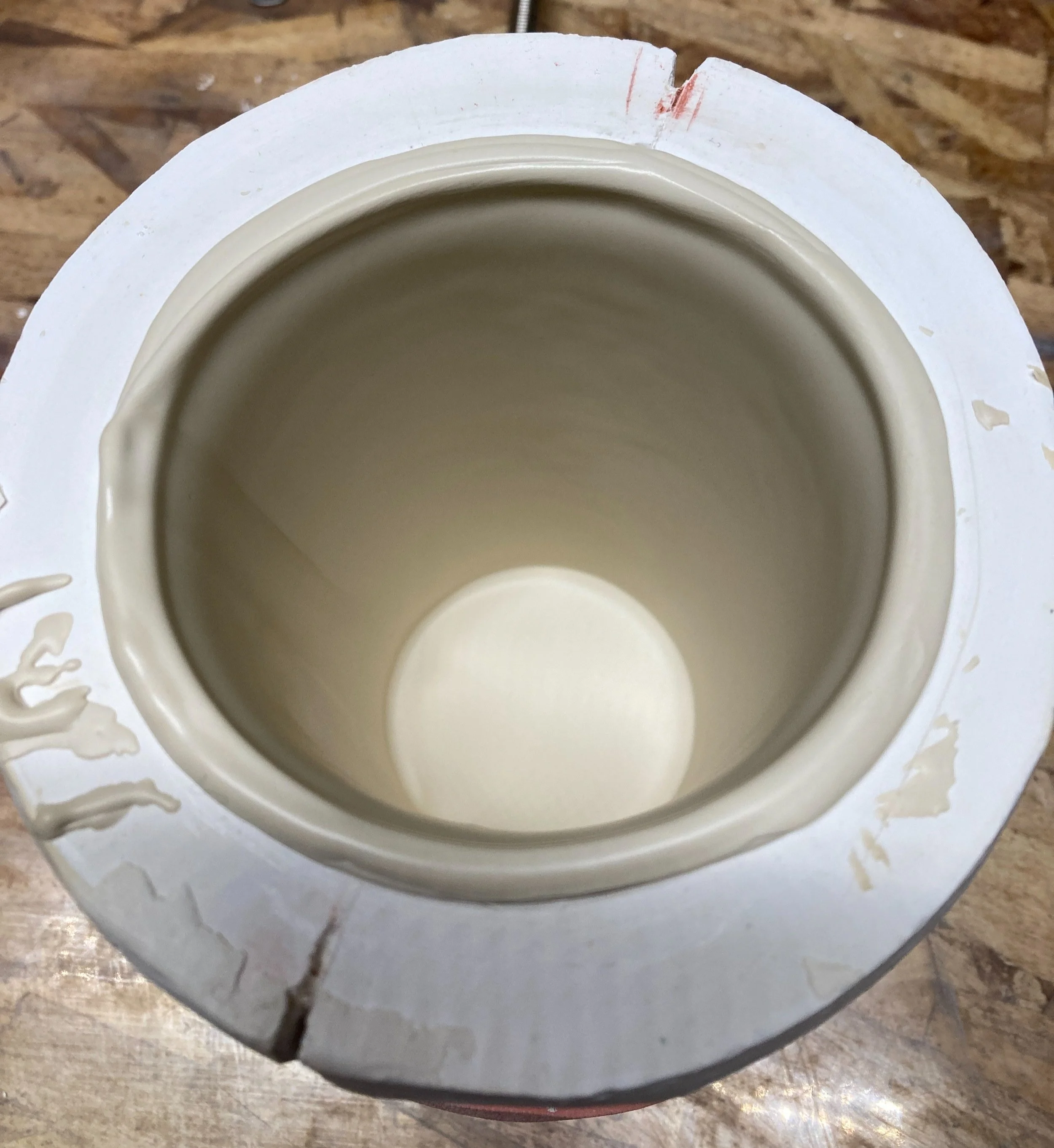 An example of a good slip cast interior. Even, no substantial drips. Casted in 13 minutes, no air bubbles, and ready for removal in 30 minutes. Along with specific gravity of slip, mold dryness, air temperature and humidity are factors in how an obje
