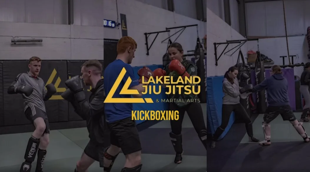 People practicing kickboxing at Lakeland Jiu Jitsu and Martial Arts gym, with some sparring with boxing gloves and pads in an indoor training facility.