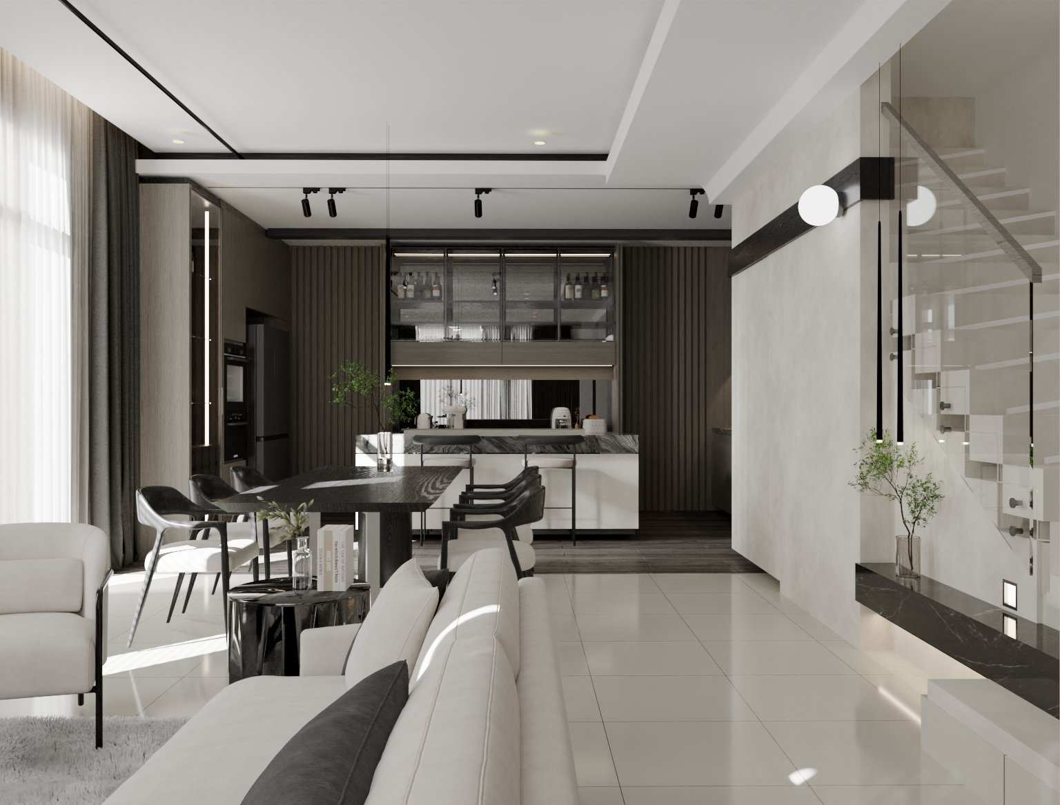 Modern living room and kitchen with white and black color scheme, large white sofa, dining table with black chairs, and kitchen area with dark wood cabinets and marble countertop.
