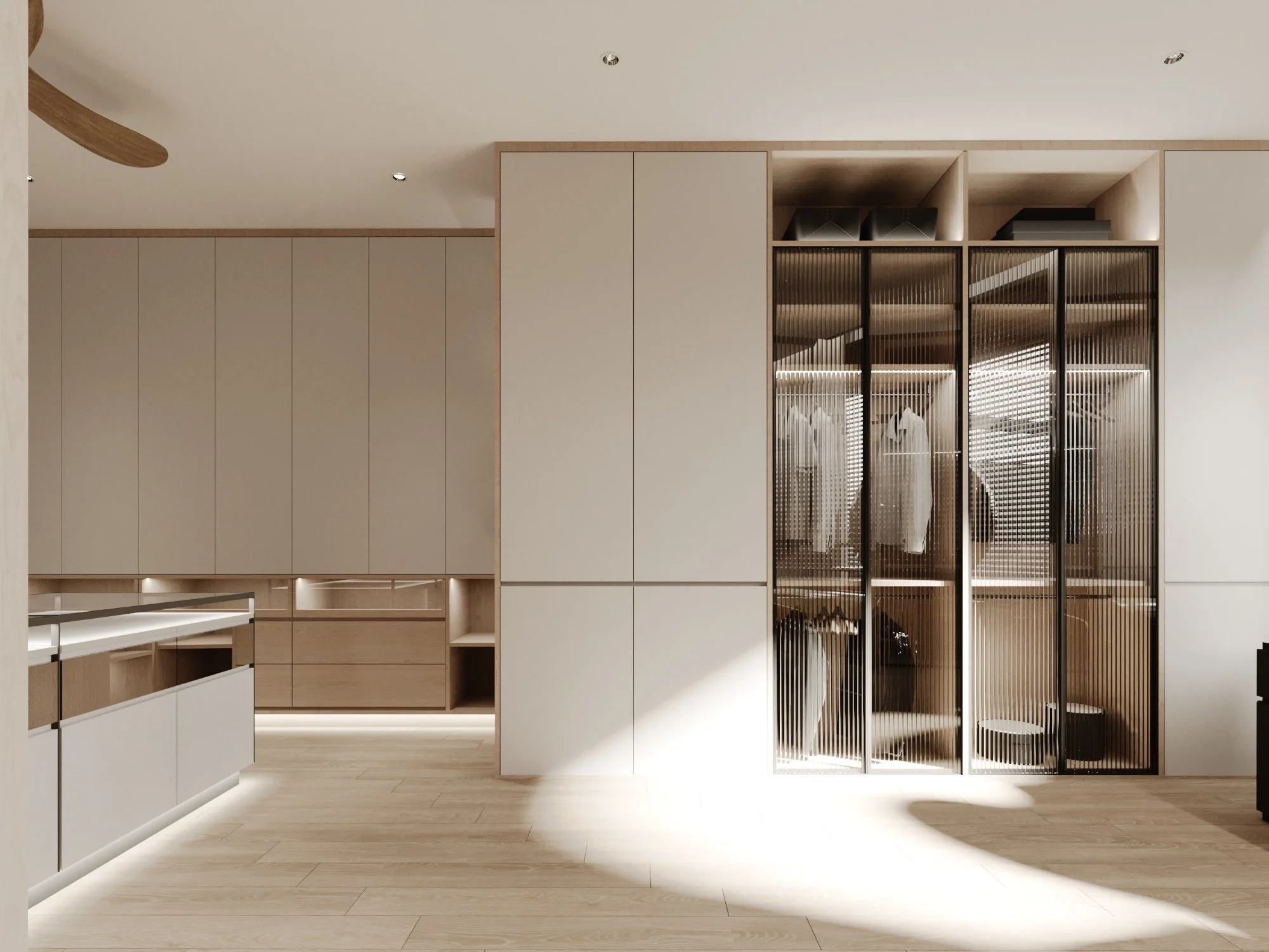 Modern walk-in closet with glass doors, white and wood cabinetry, and clothing hanging inside.