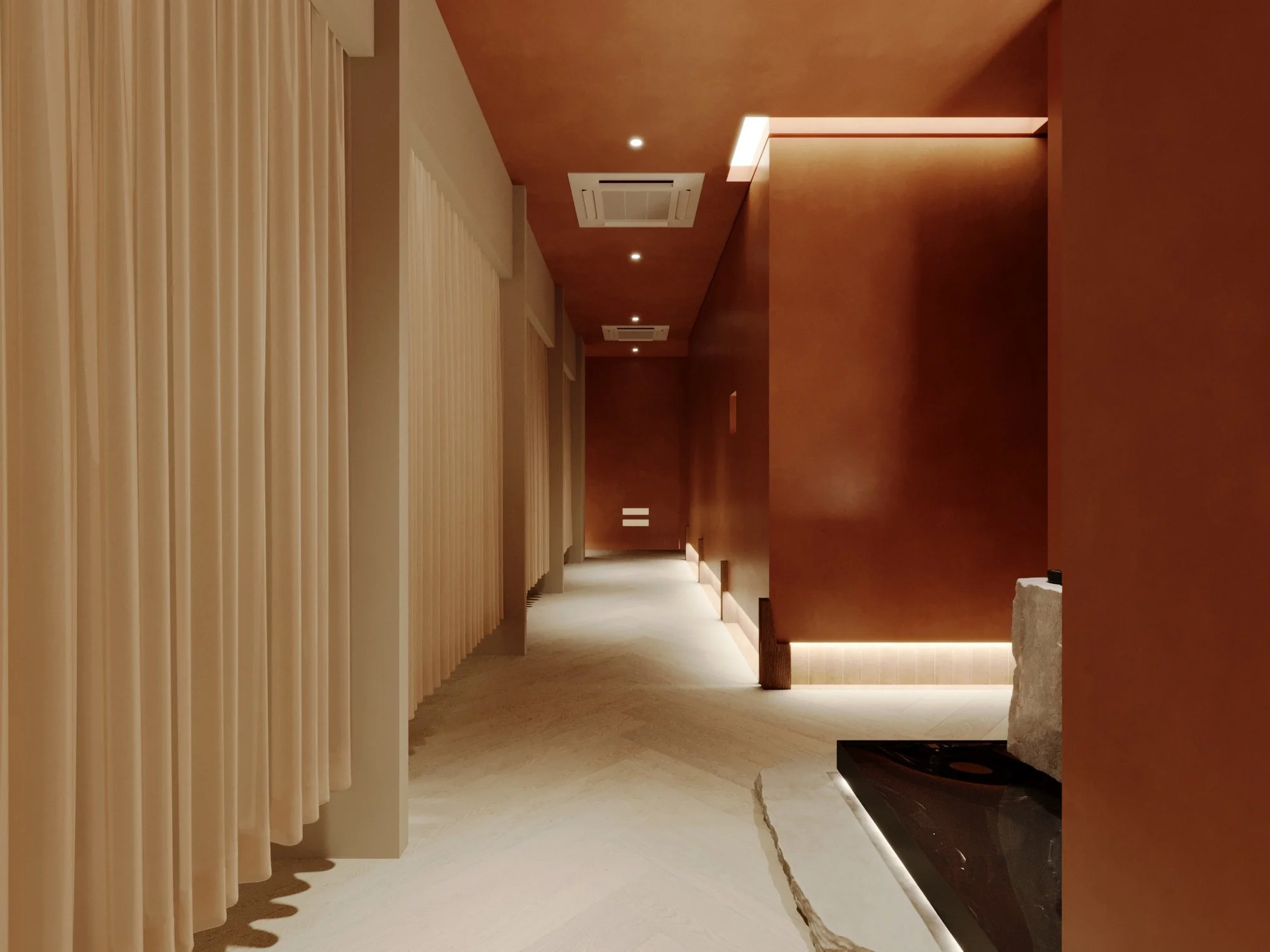 A minimalist interior corridor with beige curtains on the left and a brown wall on the right. The ceiling has recessed lighting and air conditioning vents. The floor is light-colored, and there is a stone and black surface near the bottom right corne