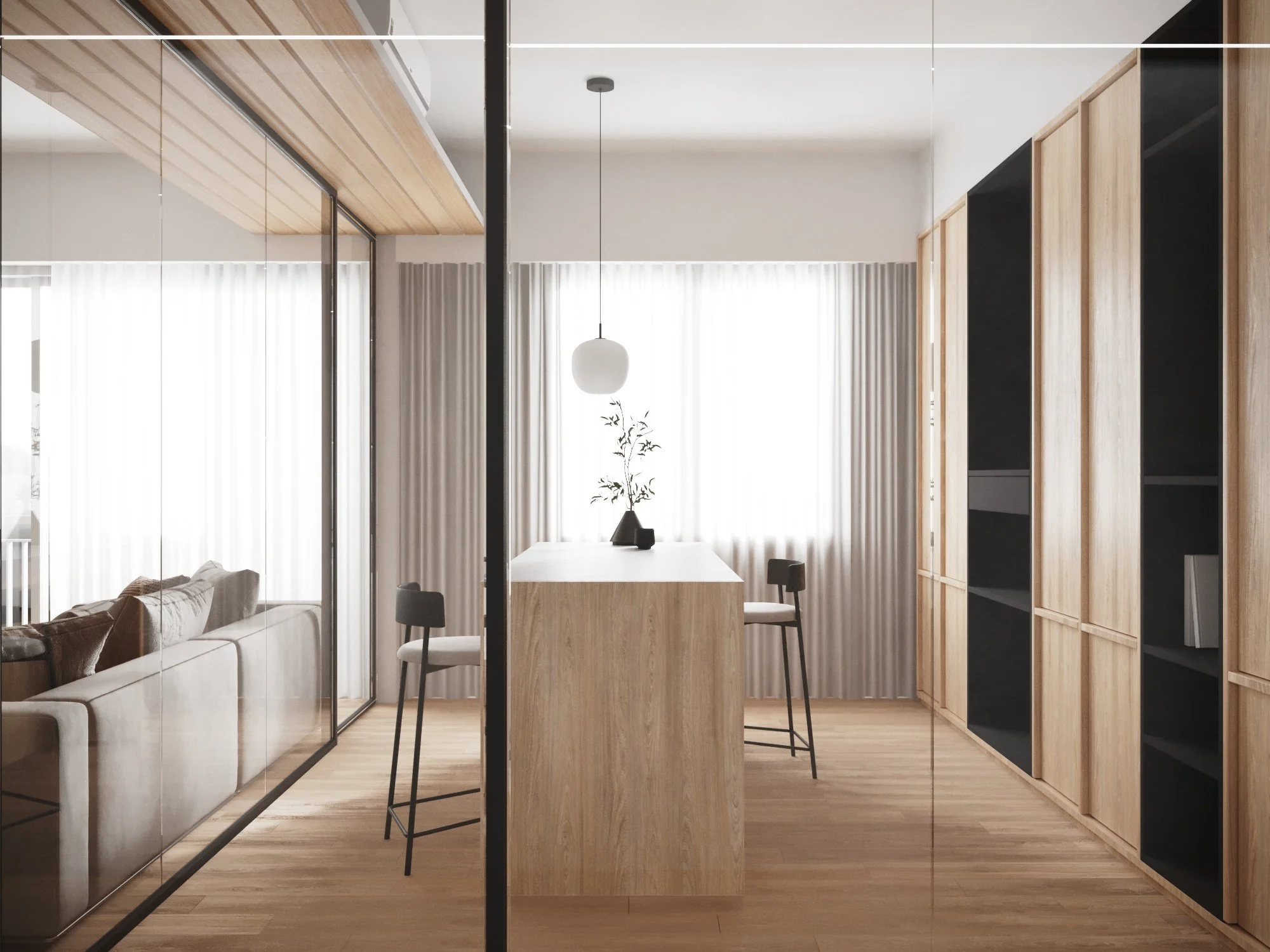 Minimalist dining area with a wooden island, two black bar stools, a pendant light, a vase with a plant, large windows with white curtains, a wooden cabinet, and a sitting area with a sofa visible through a glass partition.