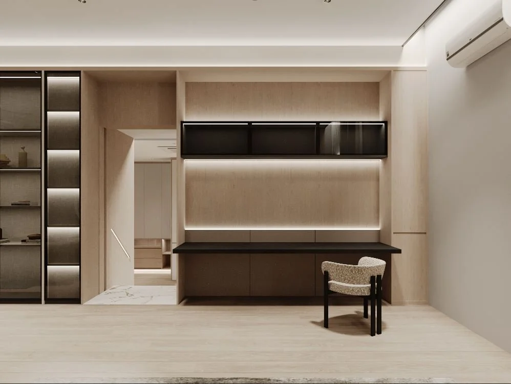 Modern interior room with built-in shelving, cabinets, a desk with a chair, and an air conditioner mounted on the wall.