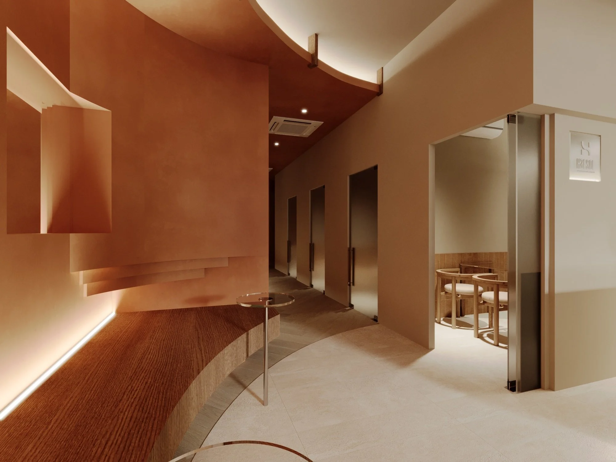 Modern, minimalist interior with curved wooden reception desk, beige walls, and a small seating area with two chairs and a table.