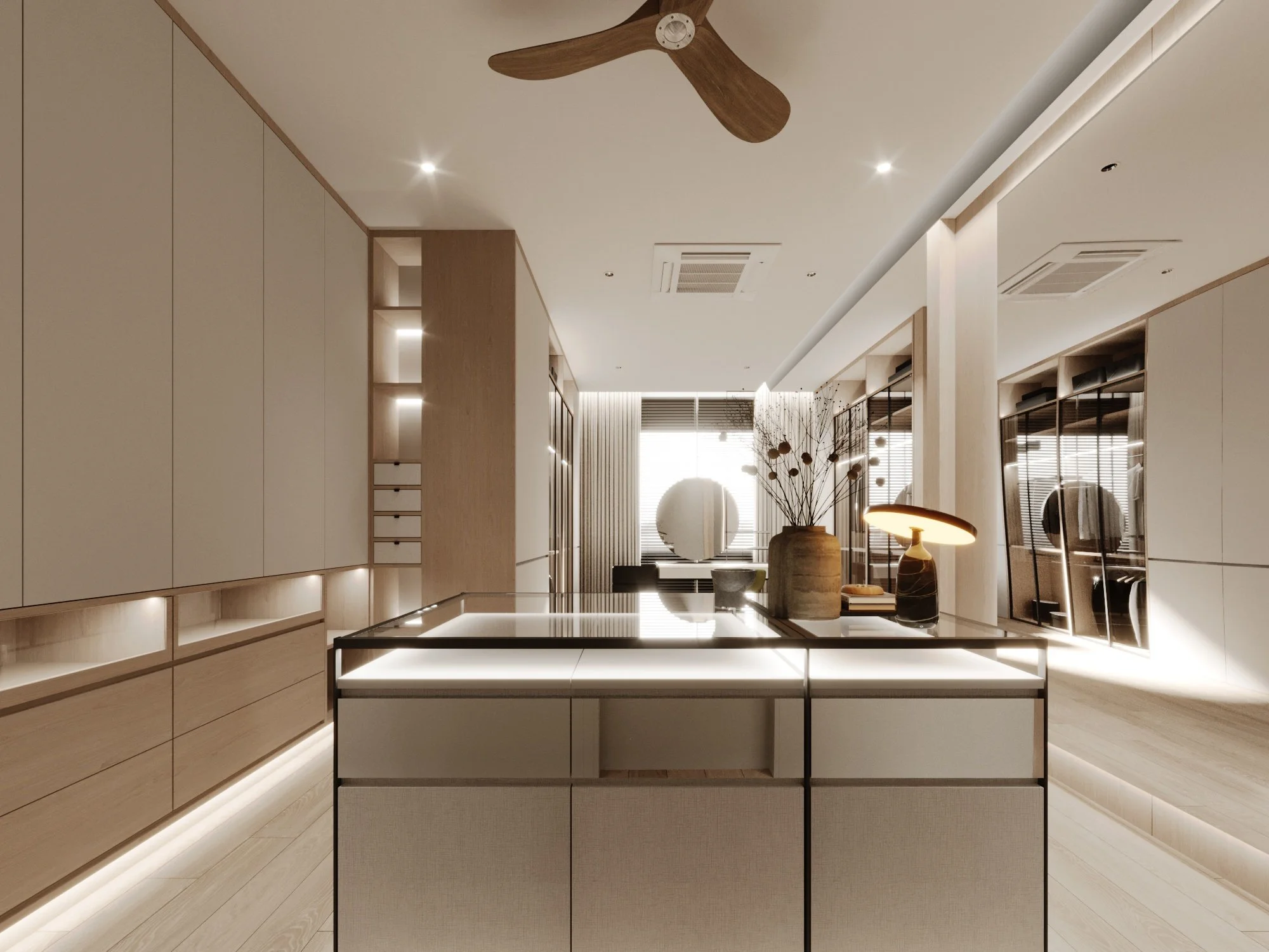 Modern, minimalist kitchen with a ceiling fan, pendant lights, and built-in wooden cabinets, decorated with vases and a small table lamp.
