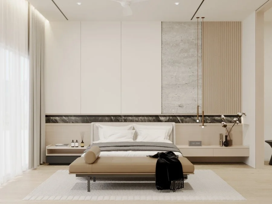 Modern minimal bedroom with beige bed, white bedding, and decorative pillows, black and beige accents, a white side table with bottles and reed diffuser, large window with sheer curtains, and wall decor with marble and wooden paneling.
