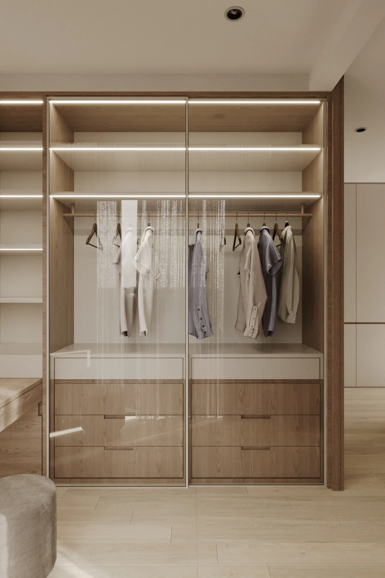 A modern wooden wardrobe with glass sliding doors, containing hanging shirts and sweaters, and multiple drawers at the bottom.