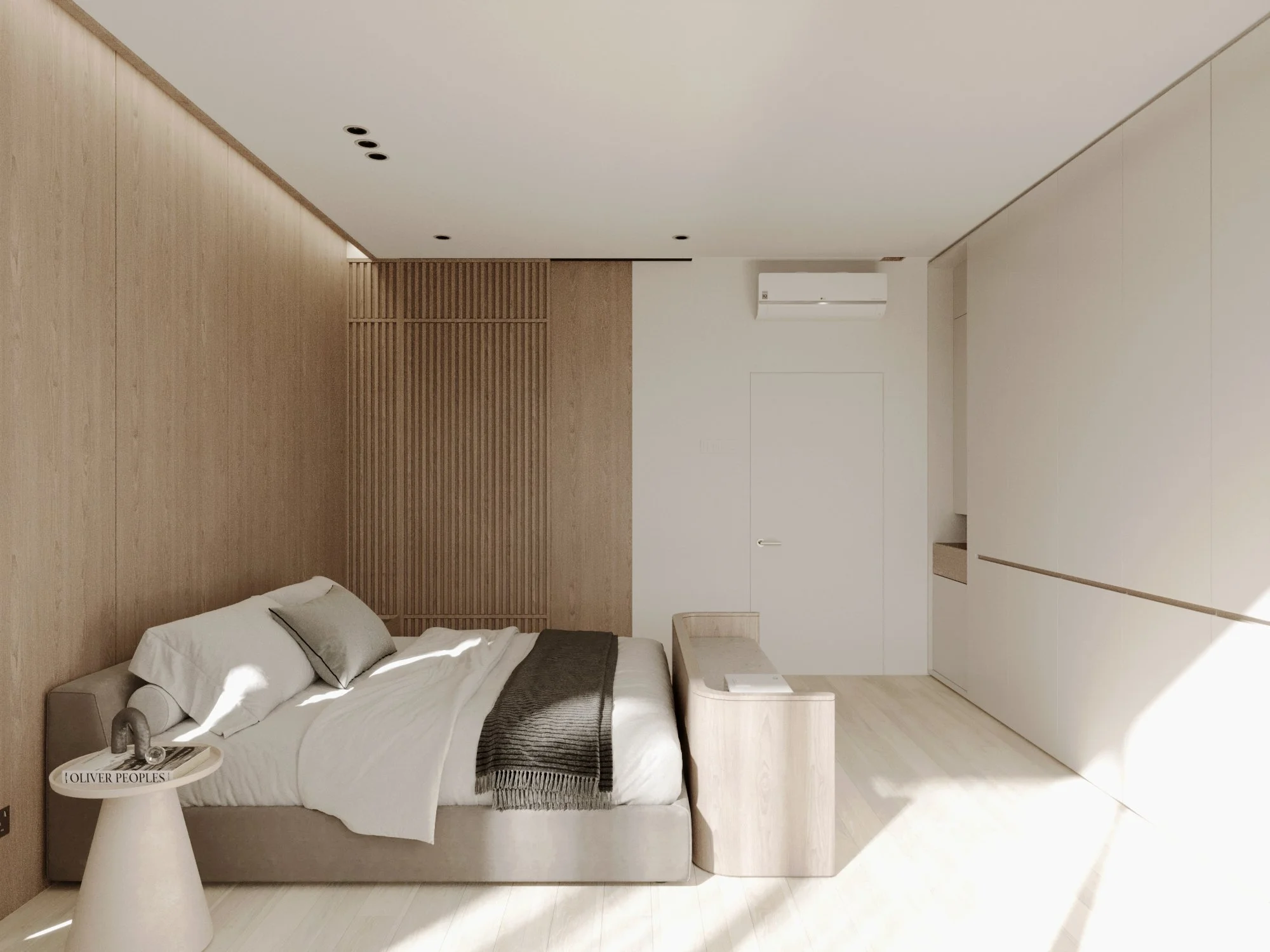 Minimalist bedroom with a bed, pillows, a blanket, a bedside table with a decorative item, a wooden partition, a white wall, and a window allowing sunlight into the room.