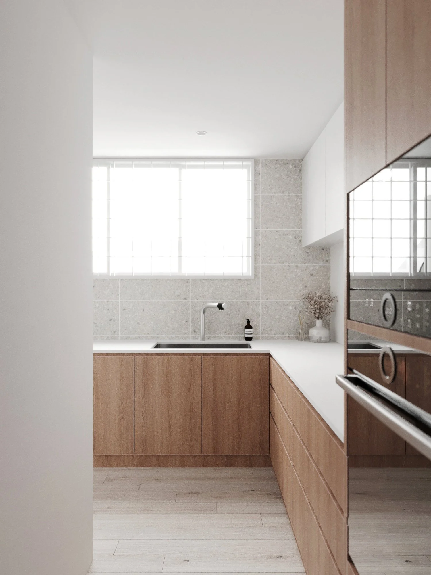 Minimalist kitchen with wooden cabinets, white countertops, a black faucet, a soap dispenser, and a large window with frosted glass.