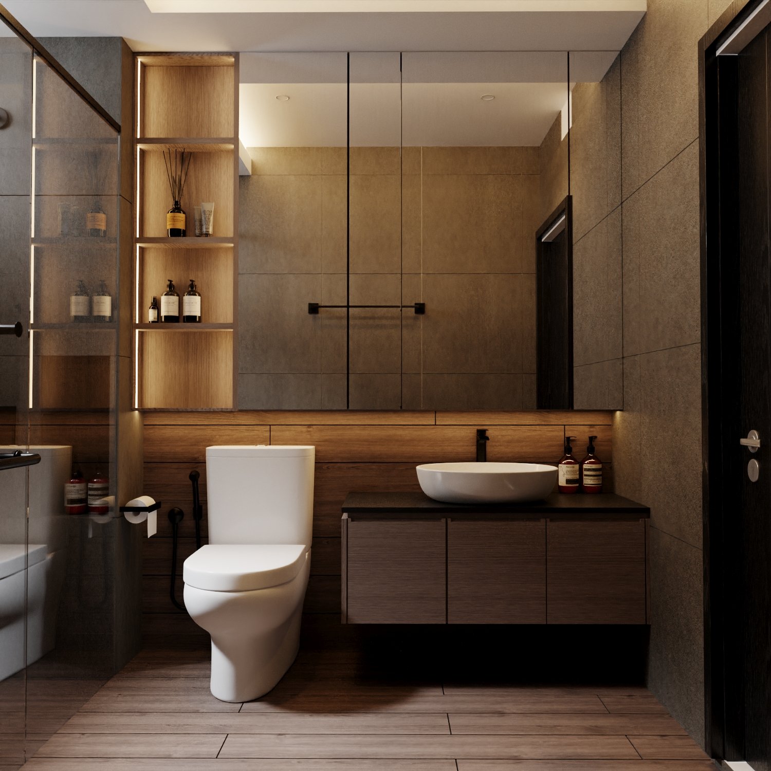 Modern bathroom with a wooden vanity, white vessel sink, and a toilet. There are bottles of soap or lotion on the vanity, and a large mirror with black metal accents above it. The walls are covered in large beige tiles, and the floor is wood.