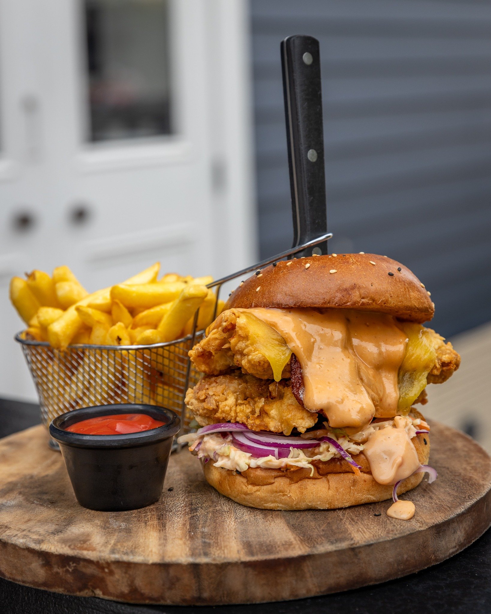 Make sure you're hungry if you're hitting up the Chur Chur Chicken Burger! 🤩

Golden buttermilk fried chicken fillet with streaky bacon, pickles, red onion, American cheddar cheese, coleslaw and homemade sriracha aioli 🍗 Served with fries 🍟

Only 