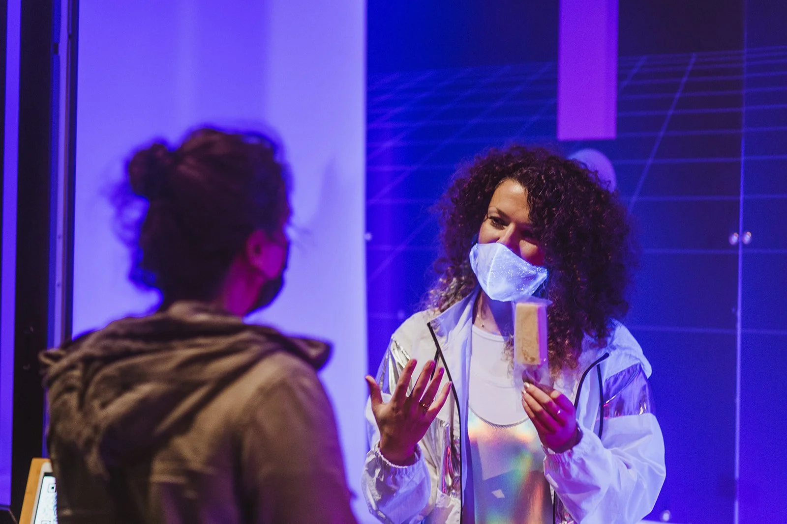 Founder explaining  how it works to a patron