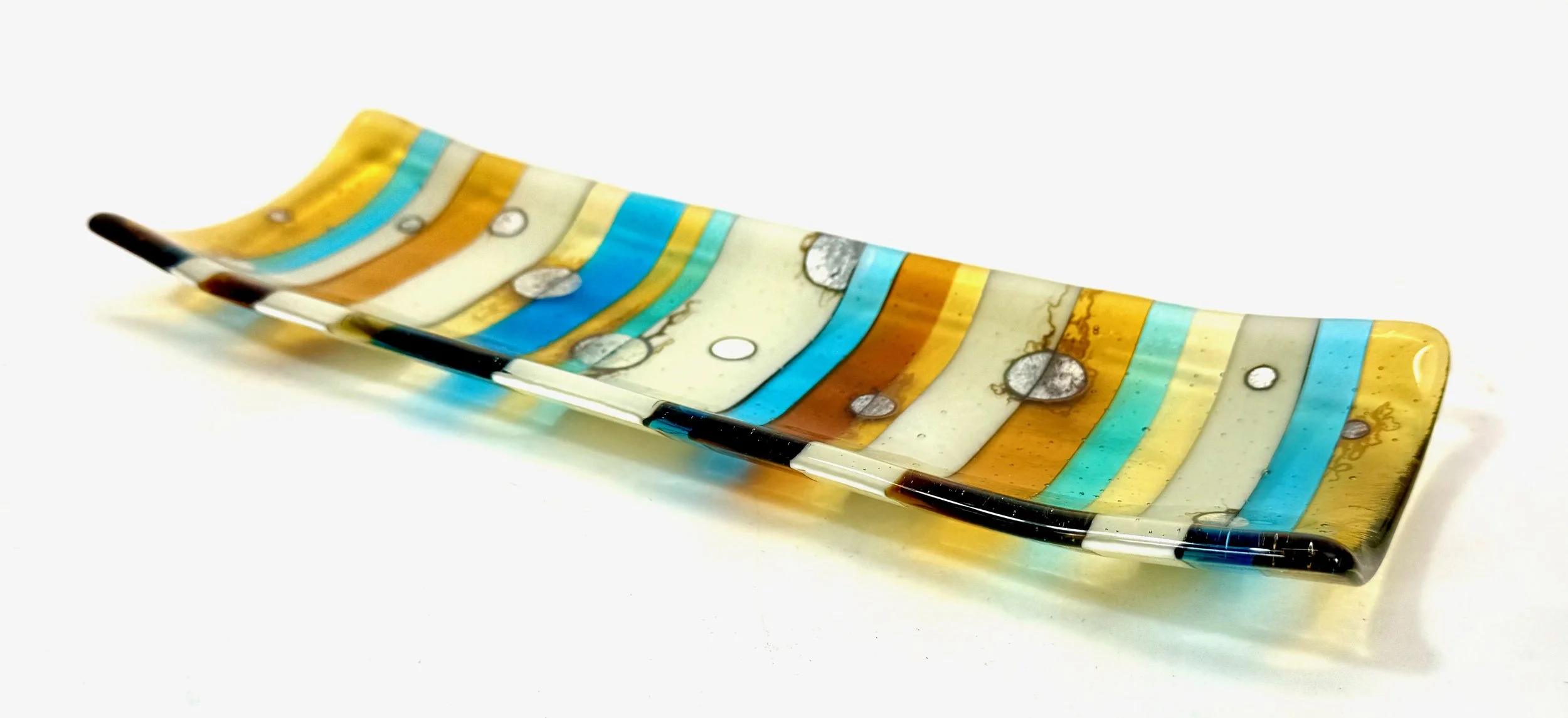 Smoke and Mirrors by Roz Speirs
9.5 x 2 x 28 cm
Image 1 of 2
For Sale: $195 - Contact Roz directly at roz@clarityglass.co.nz.
I had fun creating smoke and mirrors, combining the precision of the glass strips and placement of the silver 'mirrors' wit