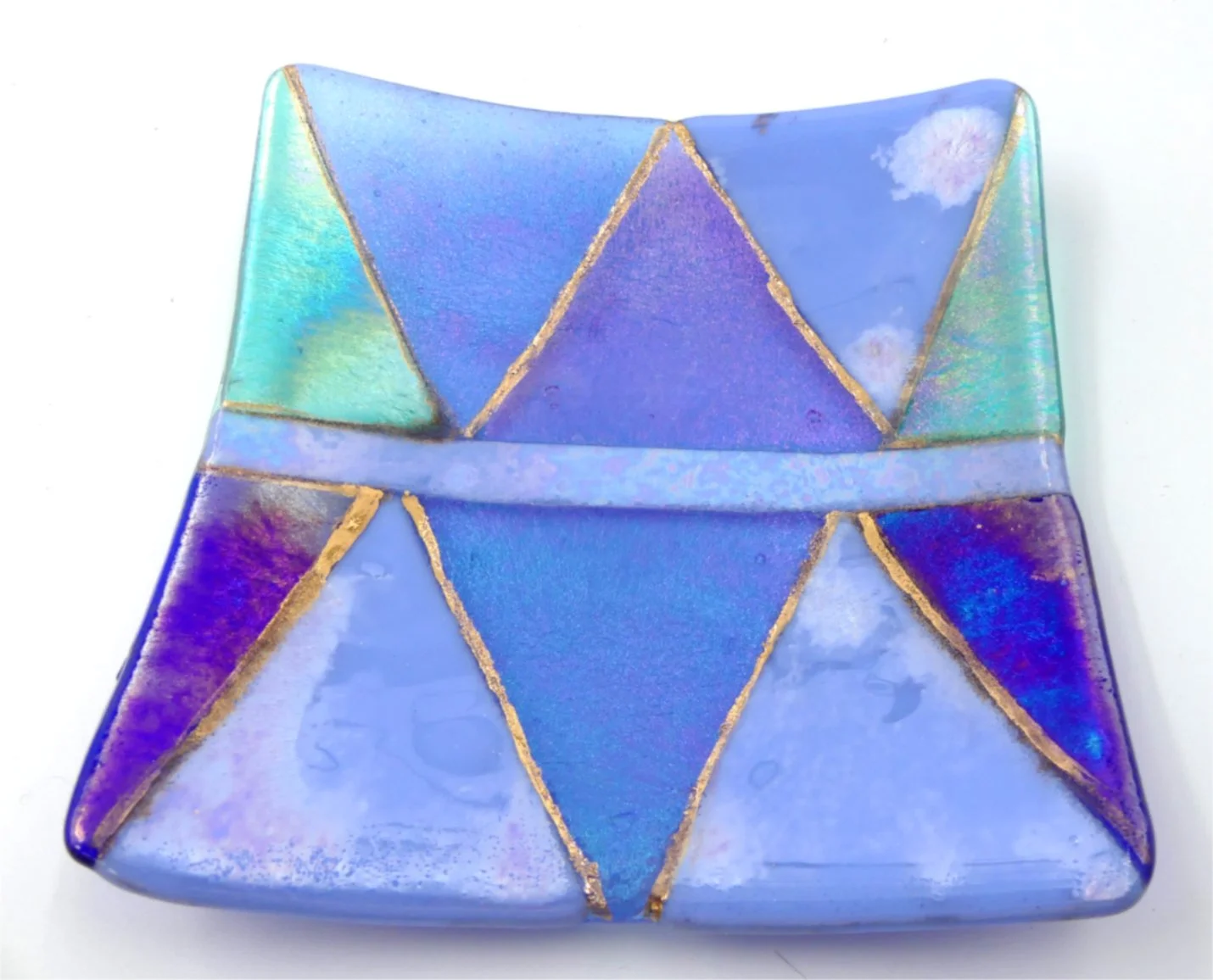 Triangle Plate by Linde Rose
15 cm x 15 cm x 2 cm
This reminds me of the sky, the different coloured lights and clouds.
For sale:  $130 - contact Linde directly to purchase linderose@hearttalk.nz
I have been dabbling in glass making for many years a