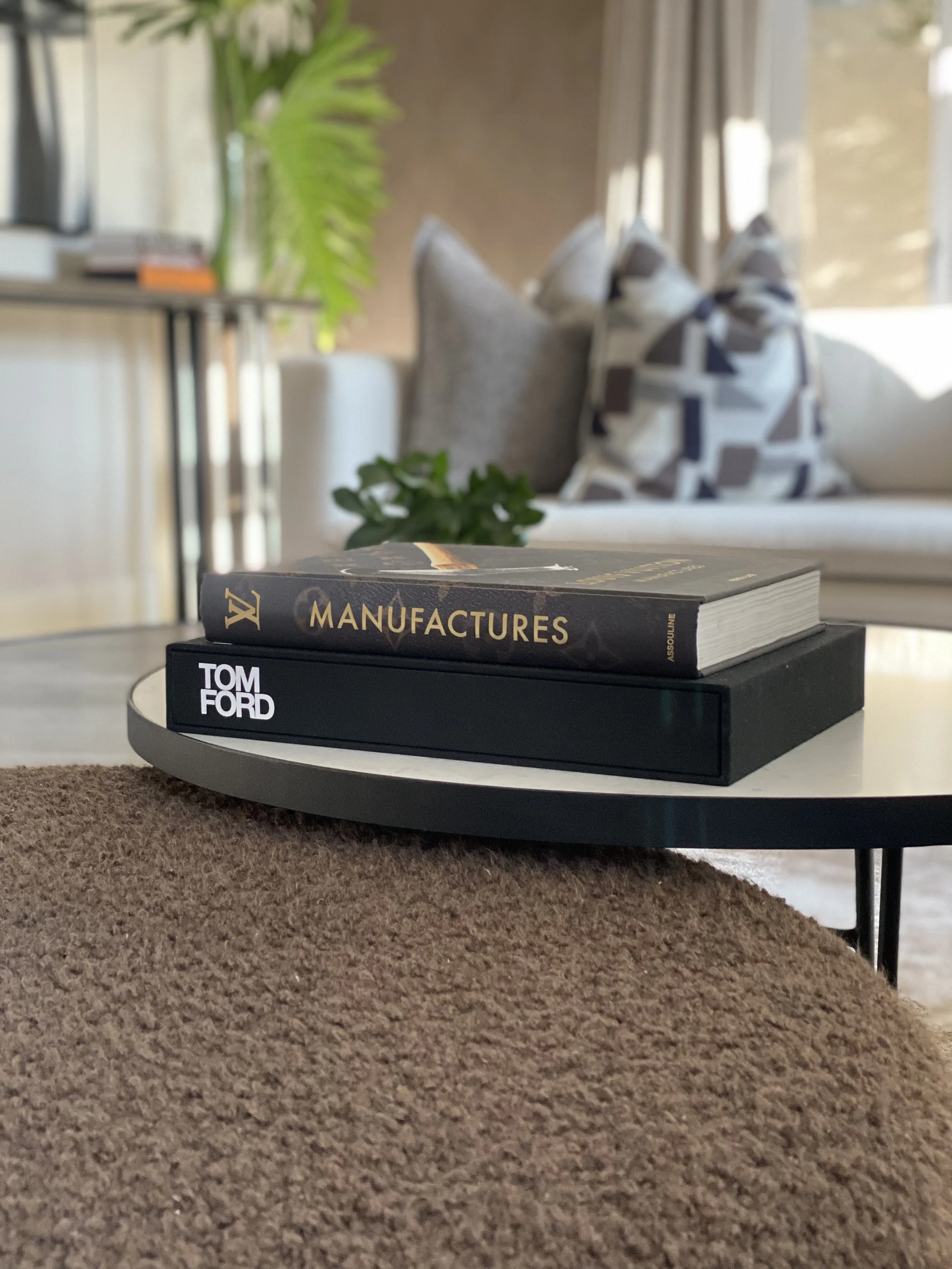 Ottoman in Cormo Chocolate by Designers Guild. Scatters in Quilvet by FibreGuard, Spartacus by FibreGuard Pro & Jamboree by Home Fabrics.