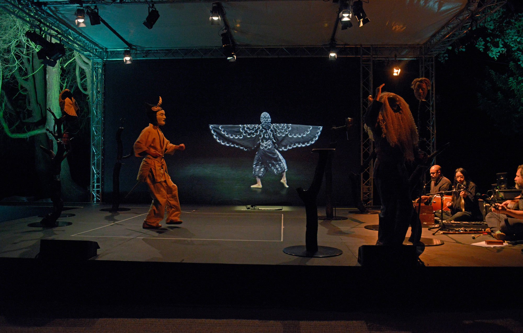 Simon Starling in collaboration with Graham Eatough. 'At Twilight: A play for two actors, three musicians, one dancer, eight masks (and a donkey costume)' 2016. Photo: Alan Dimmick