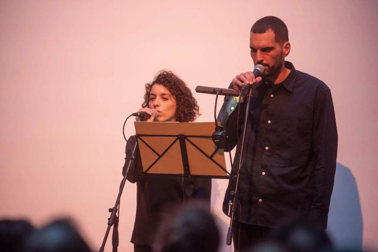 Noor Abed and Haig Aivazian, ‘Nothing will remain other than the thorn lodged in the throat of this world’. Performance at The Common Guild (2025). Photo: Alan Dimmick. Courtesy of the artists. 