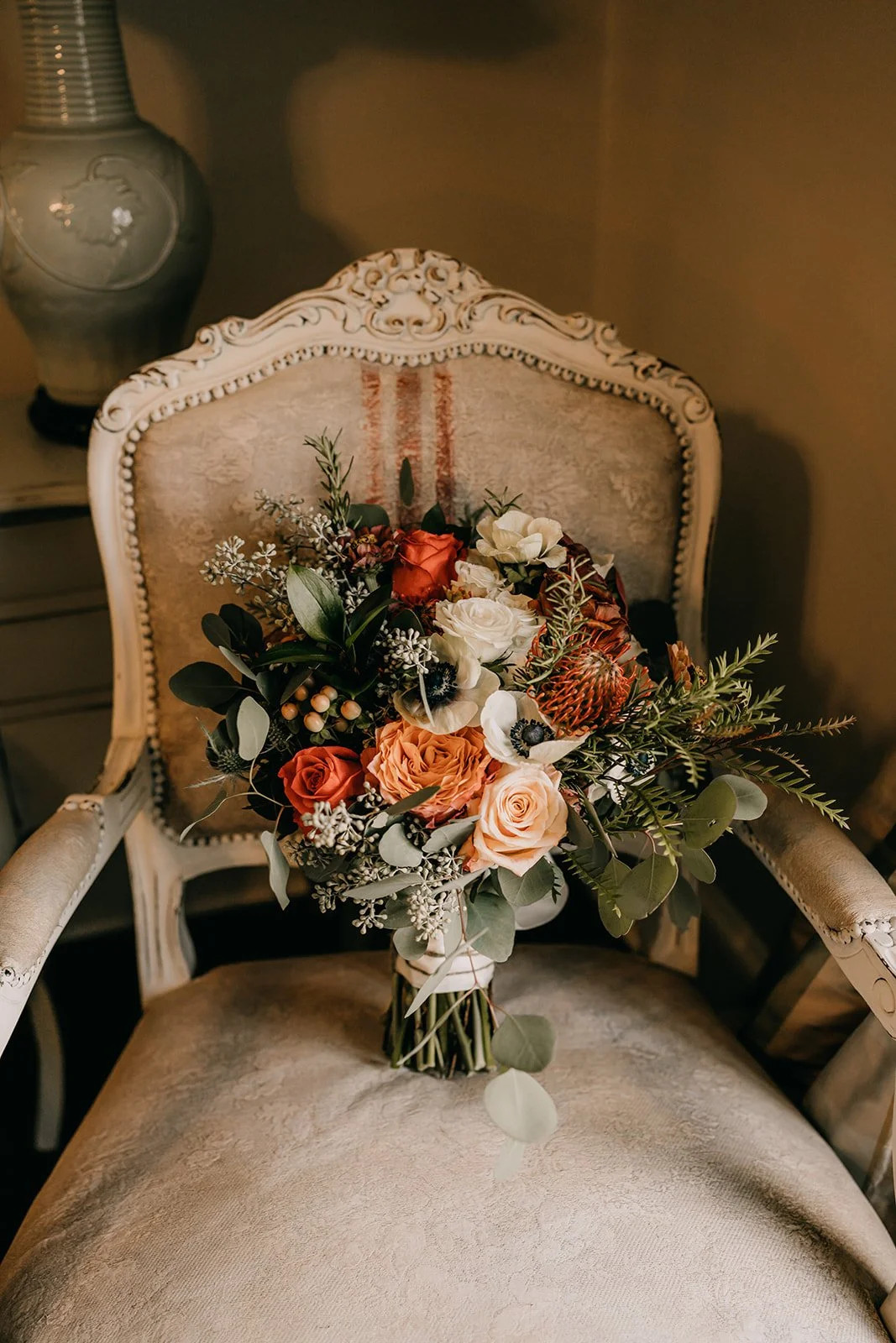 Beautiful bouquet of flowers on top of a vintage chair at Green Gables Farm.