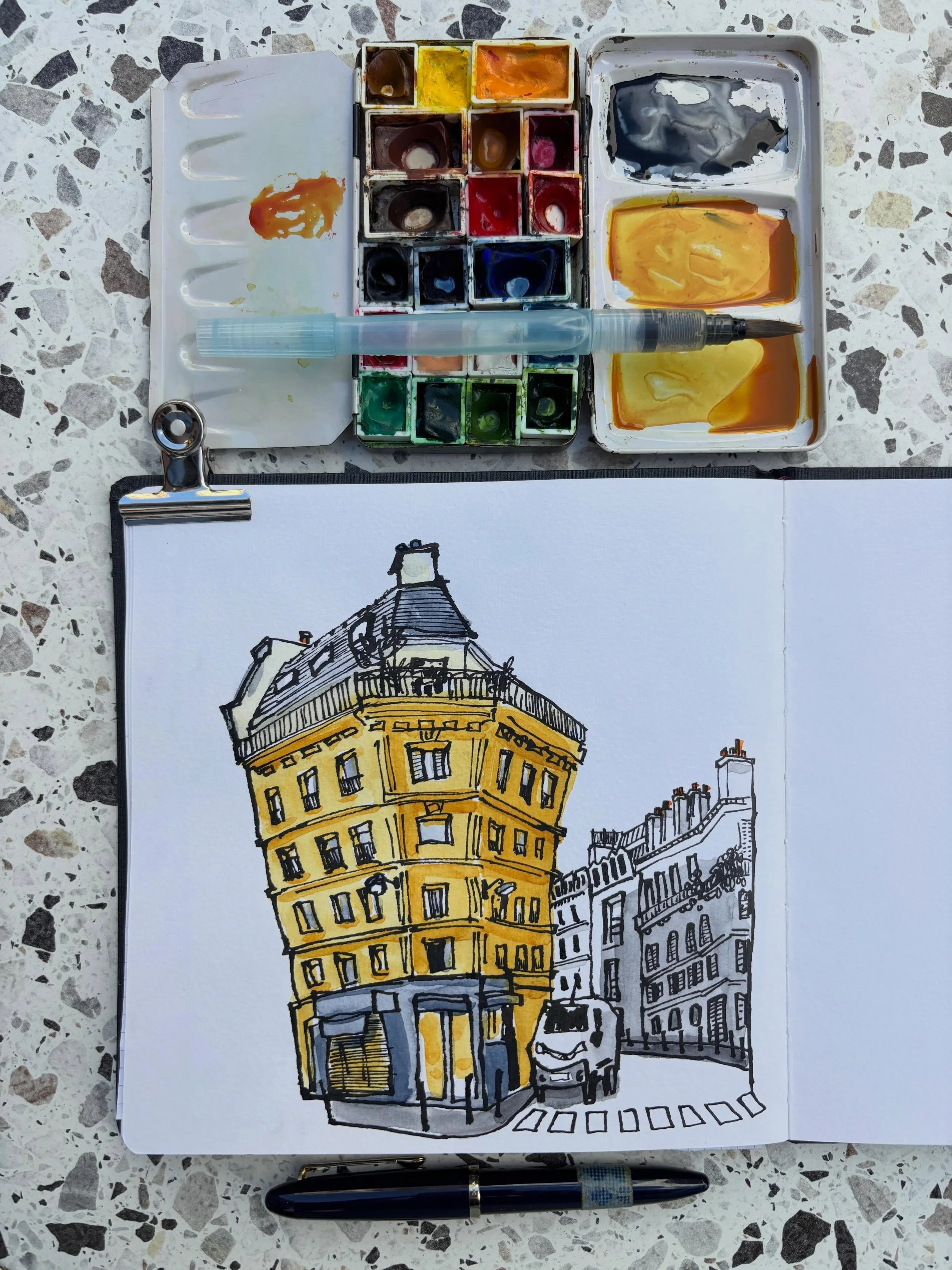 If the building turns out all wonky on the page, then a normally proportioned car would be strange to add. Lucky that I can&rsquo;t draw cars in a normal way. So there. 

Materials used:
-Hahnem&uuml;hle watercolor book, 19.5x19.5 cm
-Sailor Fude fou