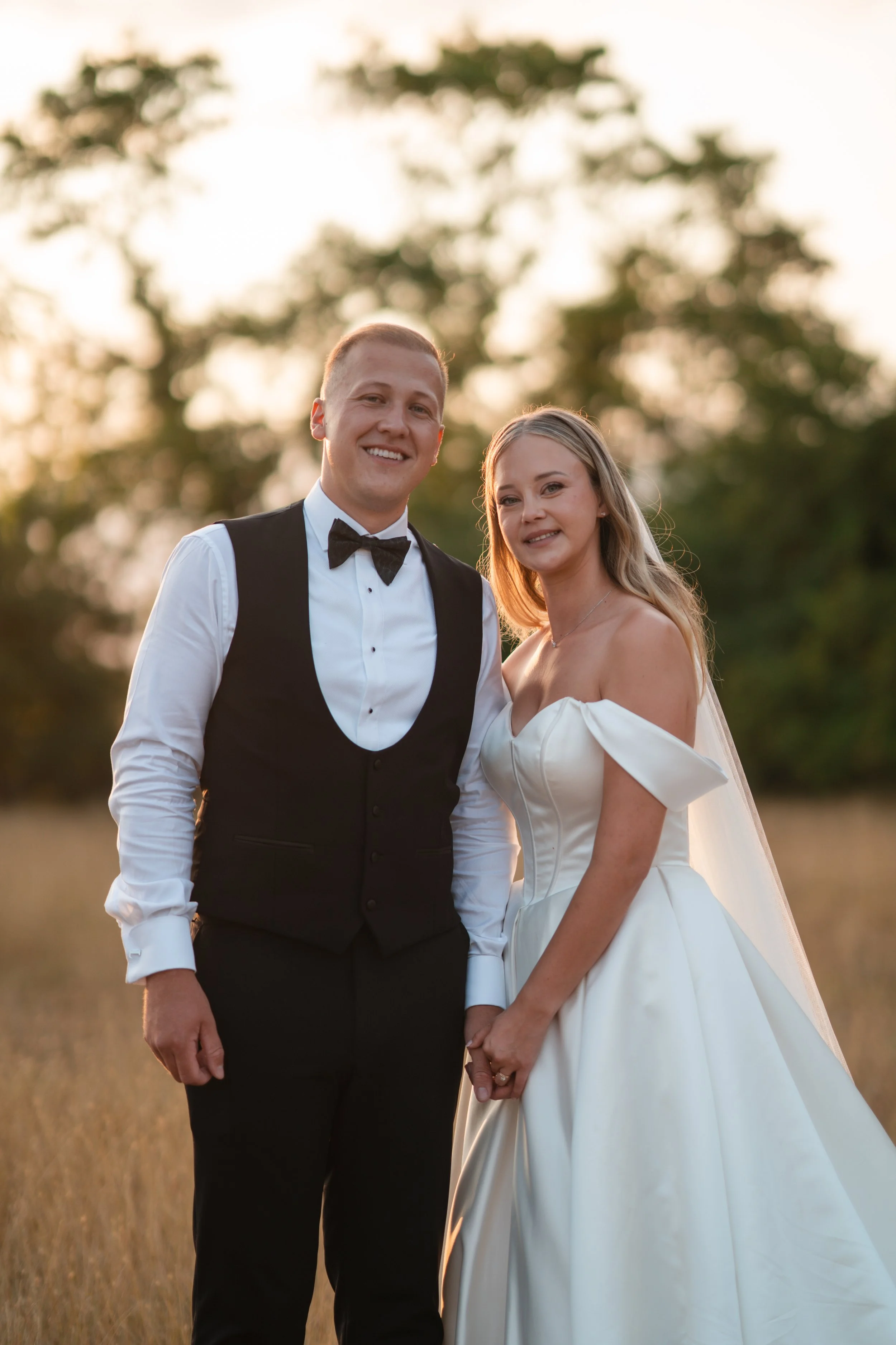 bride and groom having sunset photos at apton hall rochford essex
