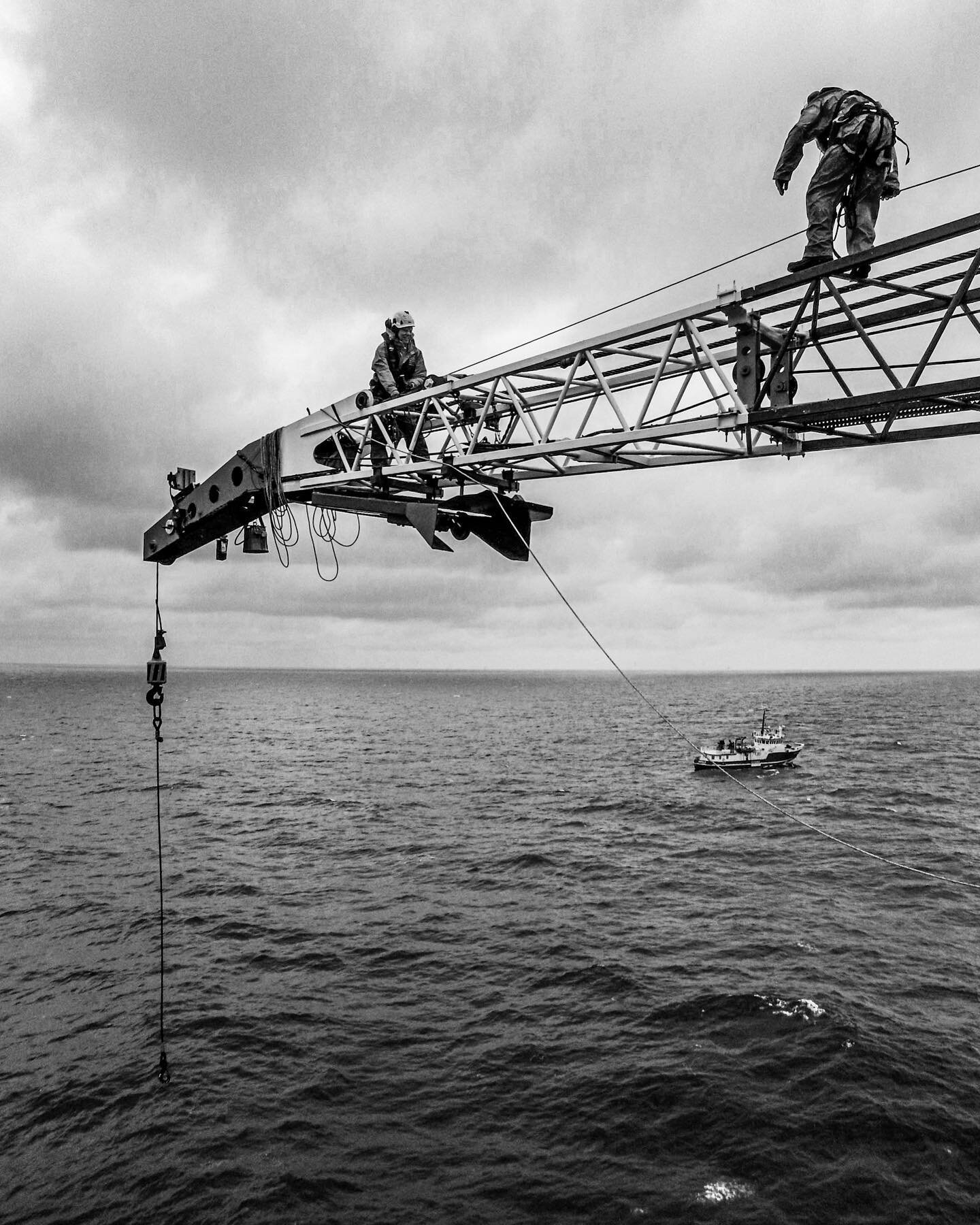 Rope access techs replacing crane guy wires. I did not taken the picture because I was on the tip of the crane😉. I did ask the guy to stand there and take the photo. So it sort of is mine😂. 

#ropeaccess #photography #blackandwhite #irata #petzlpro