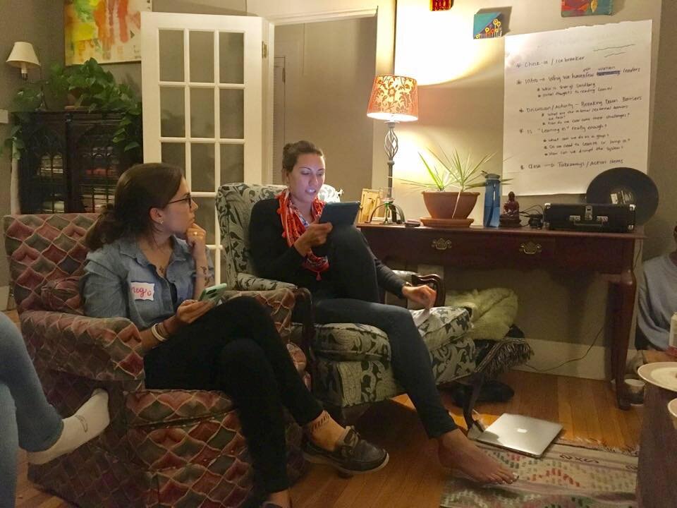 two women on a couch