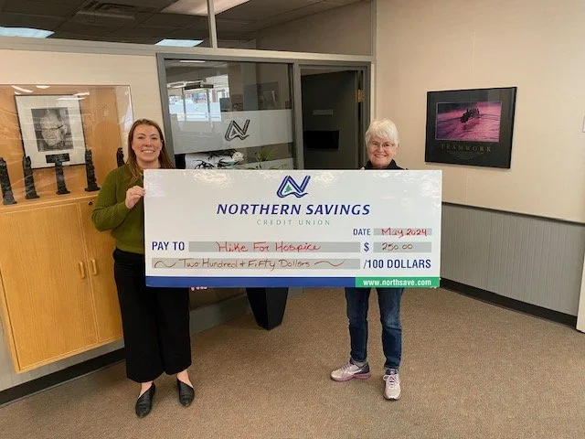 Hospice's VP Susan Crowley accepting a donation from Northern Savings Credit Union for Hike for Hospice 2024