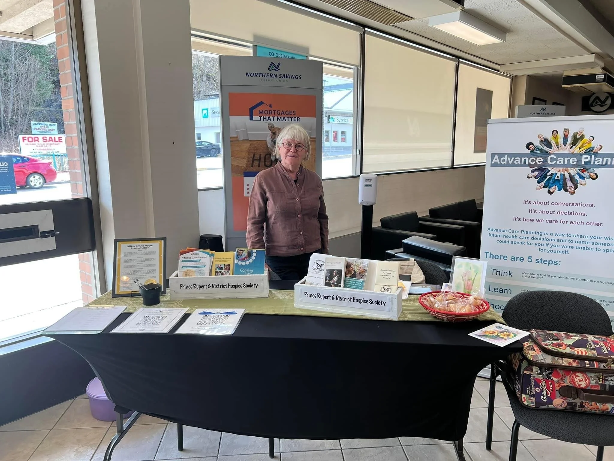 Board Vice-President Susan Crowley at Hospice's Advance Care Planning information table at Northern Saving Credit Union