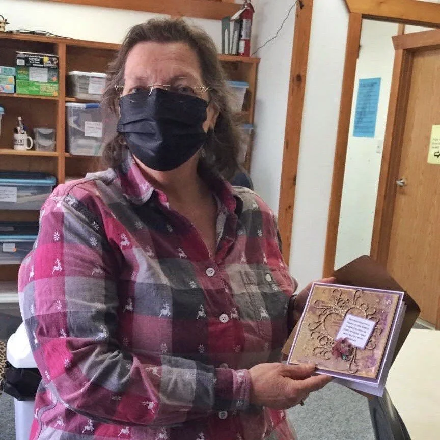 Outgoing 2021 Hospice President, Judy Riddell, receiving her thank you card.