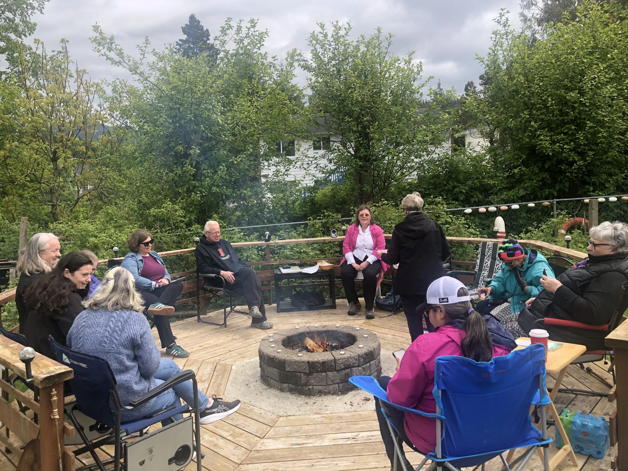Tag Burning 2025 - Participants sitting around the fire during the ceremony (June 1)