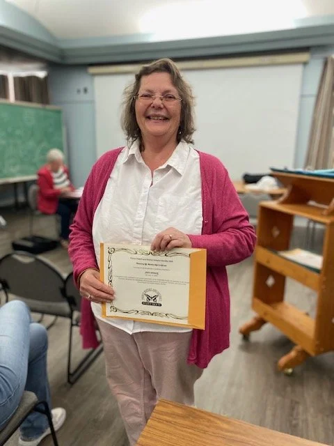 AGM 2025 - Judy Riddell with her Honorary Life Membership Certificate (June 15)