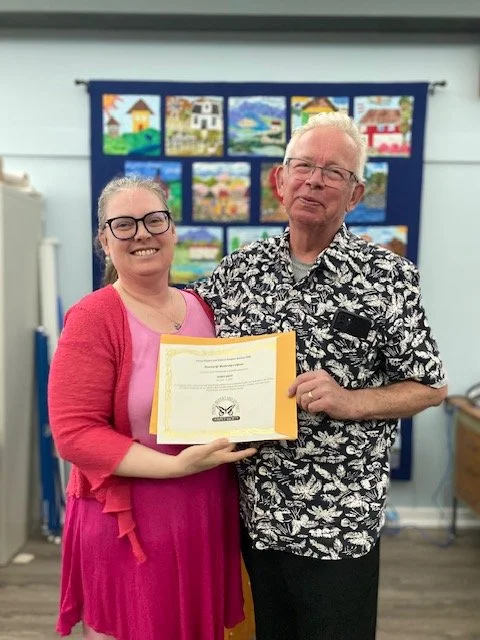 AGM 2025 - Derry Bott receiving his Honorary Life Membership from outgoing President, Anne Falvo (June 15)