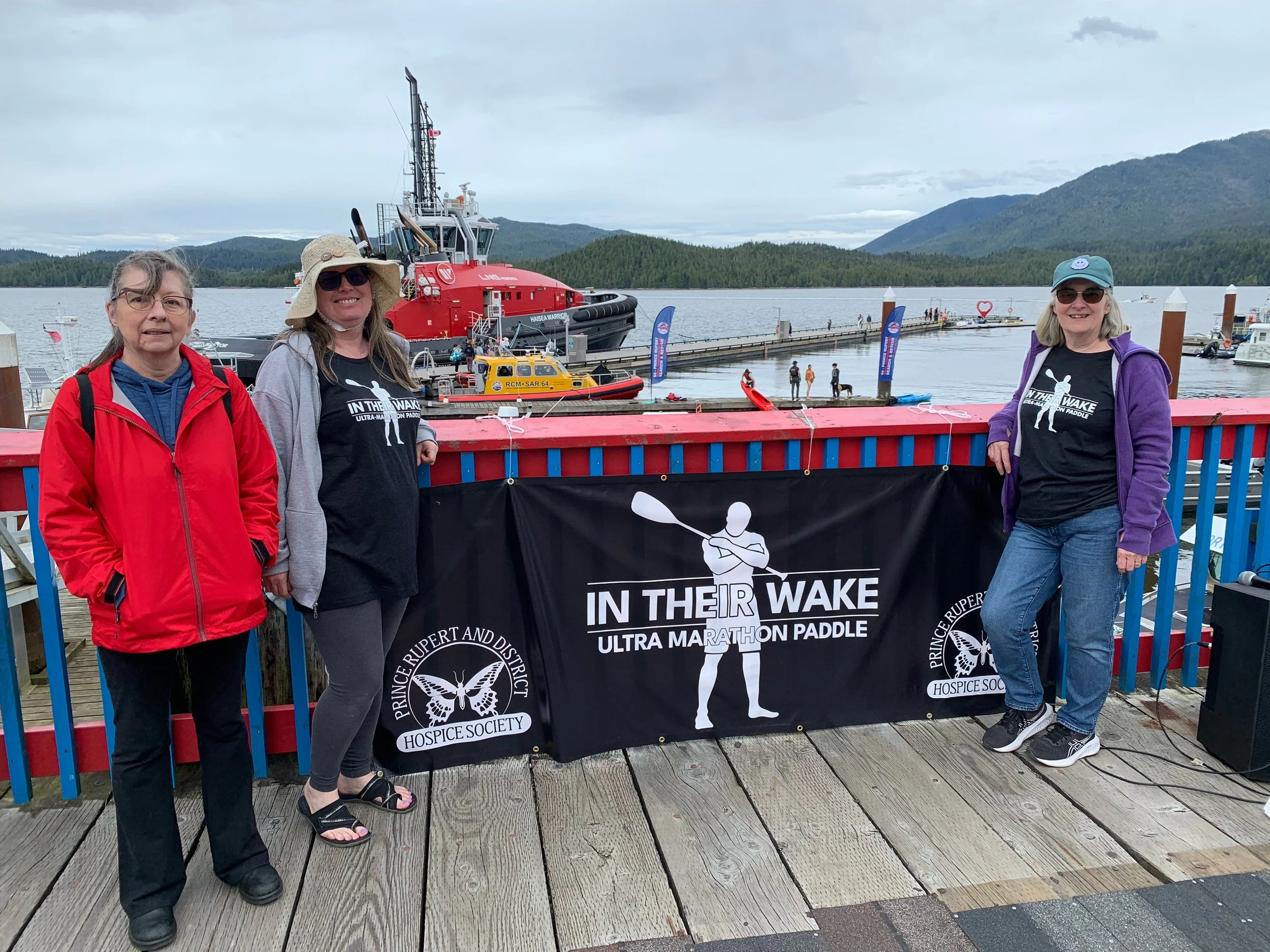 Hospice Board Members proudly displaying the new In Their Wake sign - June 15