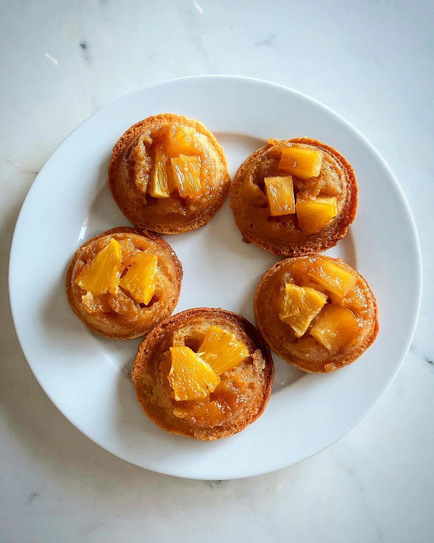 We made pi&ntilde;a coladas, but we also made pineapple upside down muffins! Sticky sweet, tropical and delicious! #baking #pineapple 🍍🍍🍍