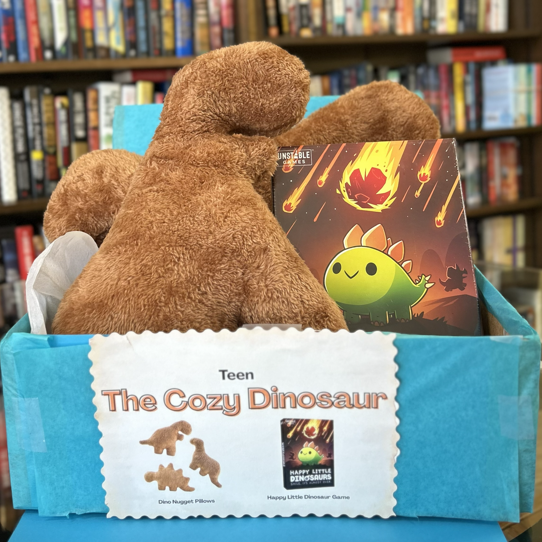 Teen Cozy Dinosaur bundle includes Dino Nuggie pillows, and Happy Little Dinosaurs game
