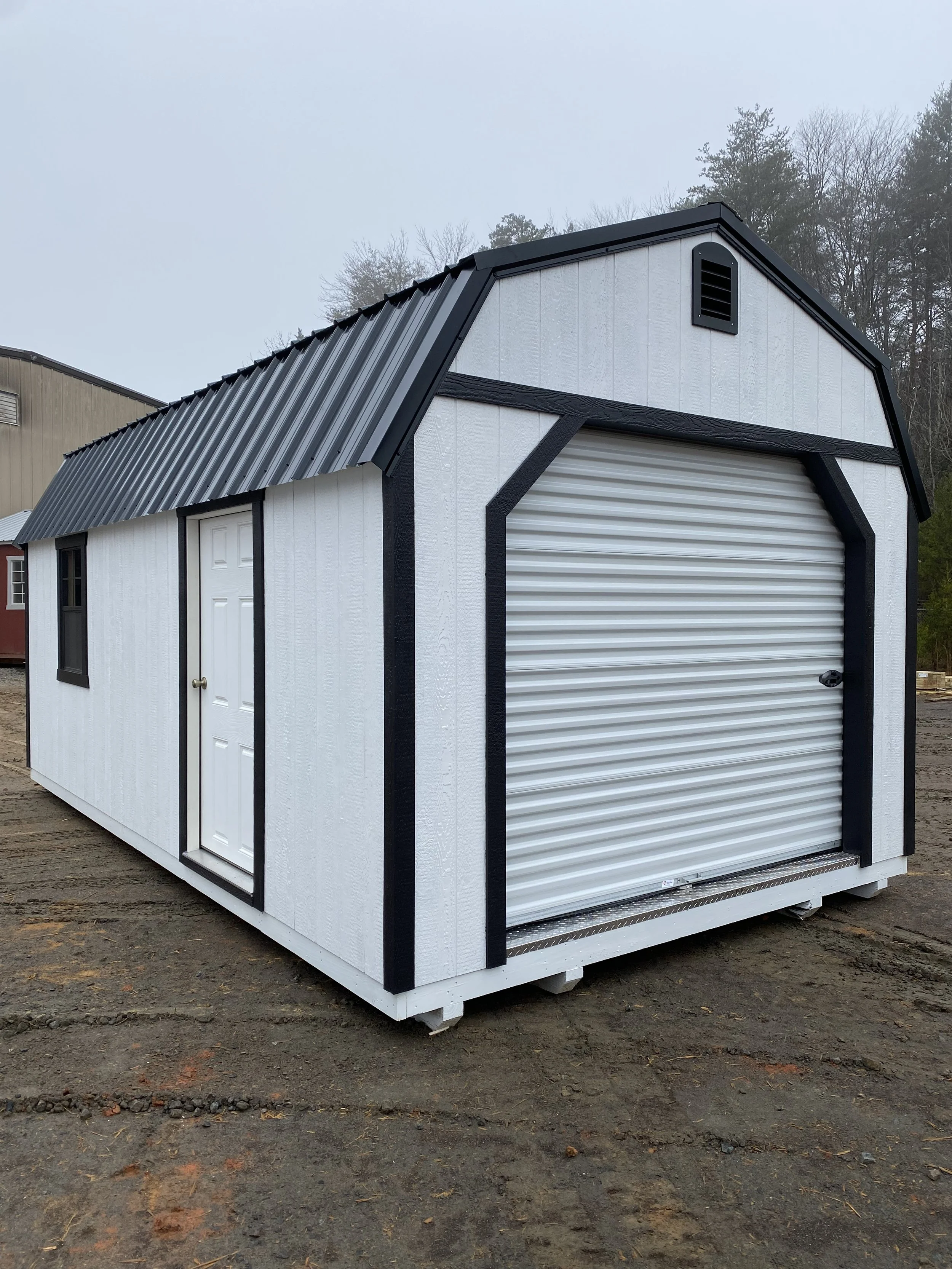 garage with overhead door white with black trim.jpeg