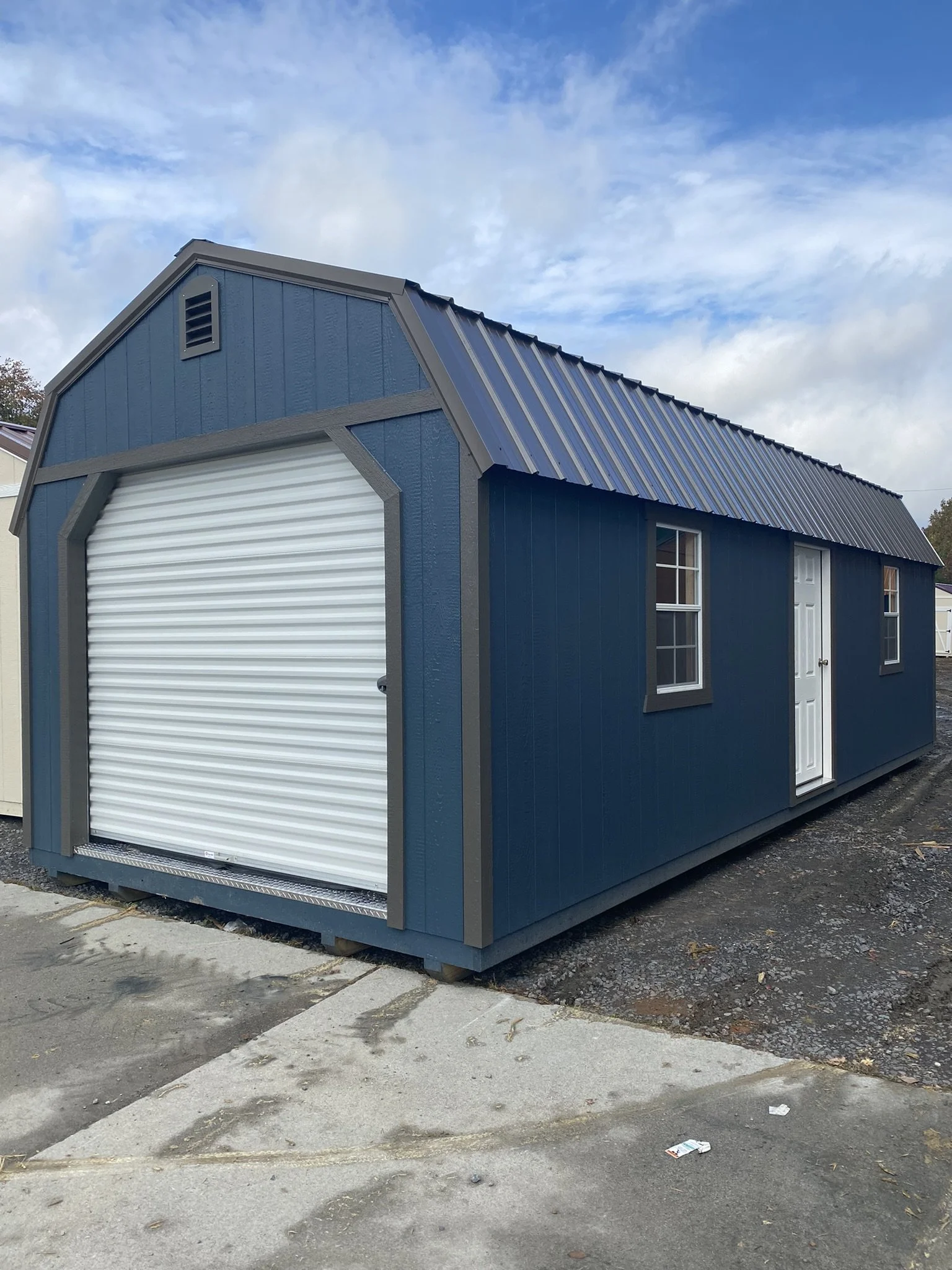 alpine shed garage blue with rollup door.jpeg