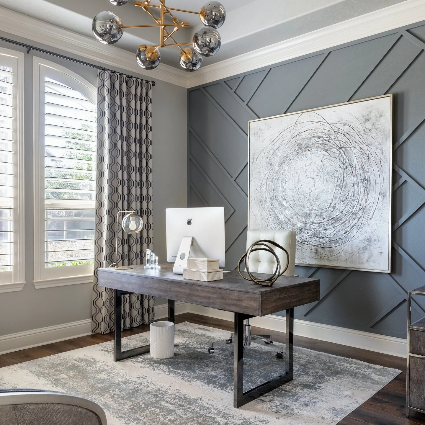 We hope you&rsquo;re not working this week, but if you are? Make it a great space! 😉

This office is the perfect example of how you can mix geometrics, metals, modern lines, layered neutrals &amp; bold architectural trim AND still create cohesivenes