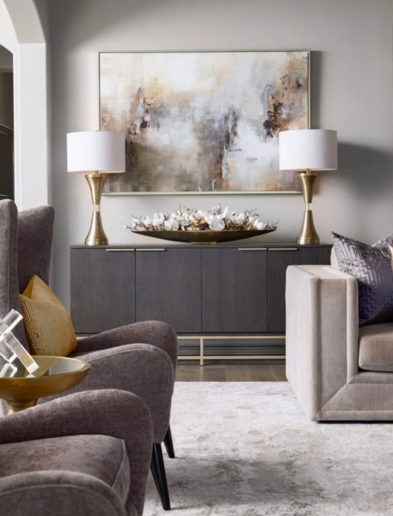 Our Haslet clients wanted a modern living room that still felt warm, cozy, but homey &amp; personal. Keeping their family photos was important, but instead of competing with the new design, we gave them a moment of their own! 

Just around the corner