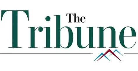 Logo of The Tribune with the name in green letters and a stylized mountain graphic underneath.