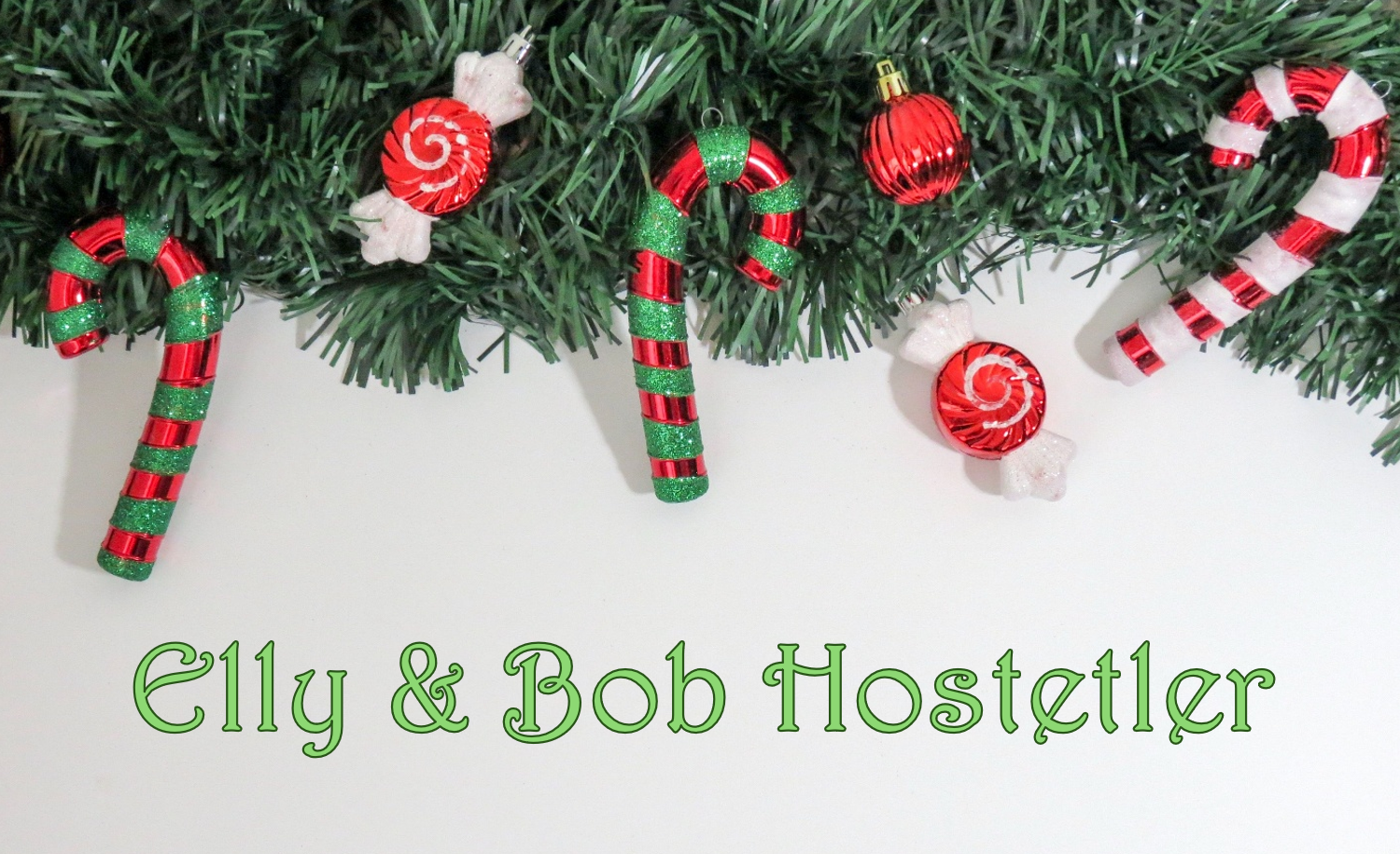 Decorative Christmas border with green garland and red and white striped candies and ornaments, with the text 'Elly & Bob Hostetler' written in green across a white background.