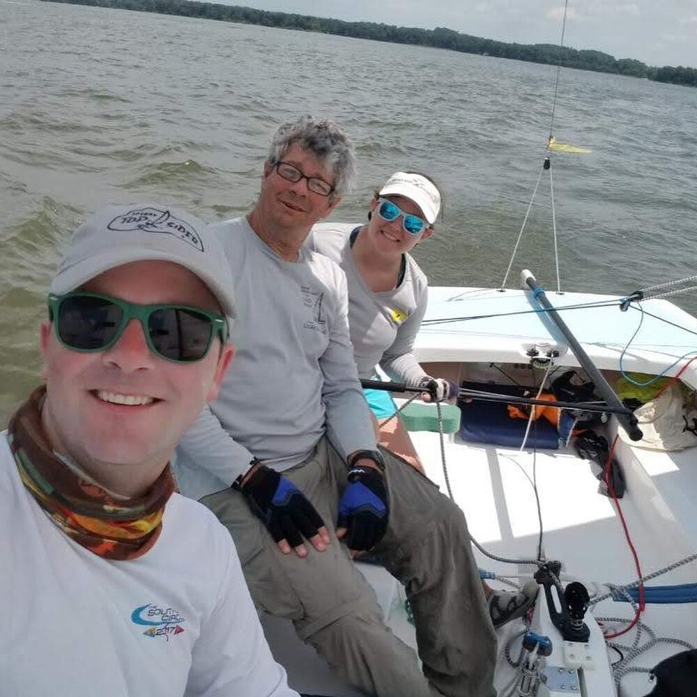 Kirsten, Brian, and Bob racing his lightning on the York River